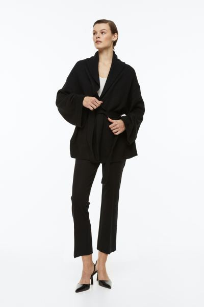 Fijngebreid kabelvest met strikceintuur | H&M (DE, AT, CH, NL, FI)