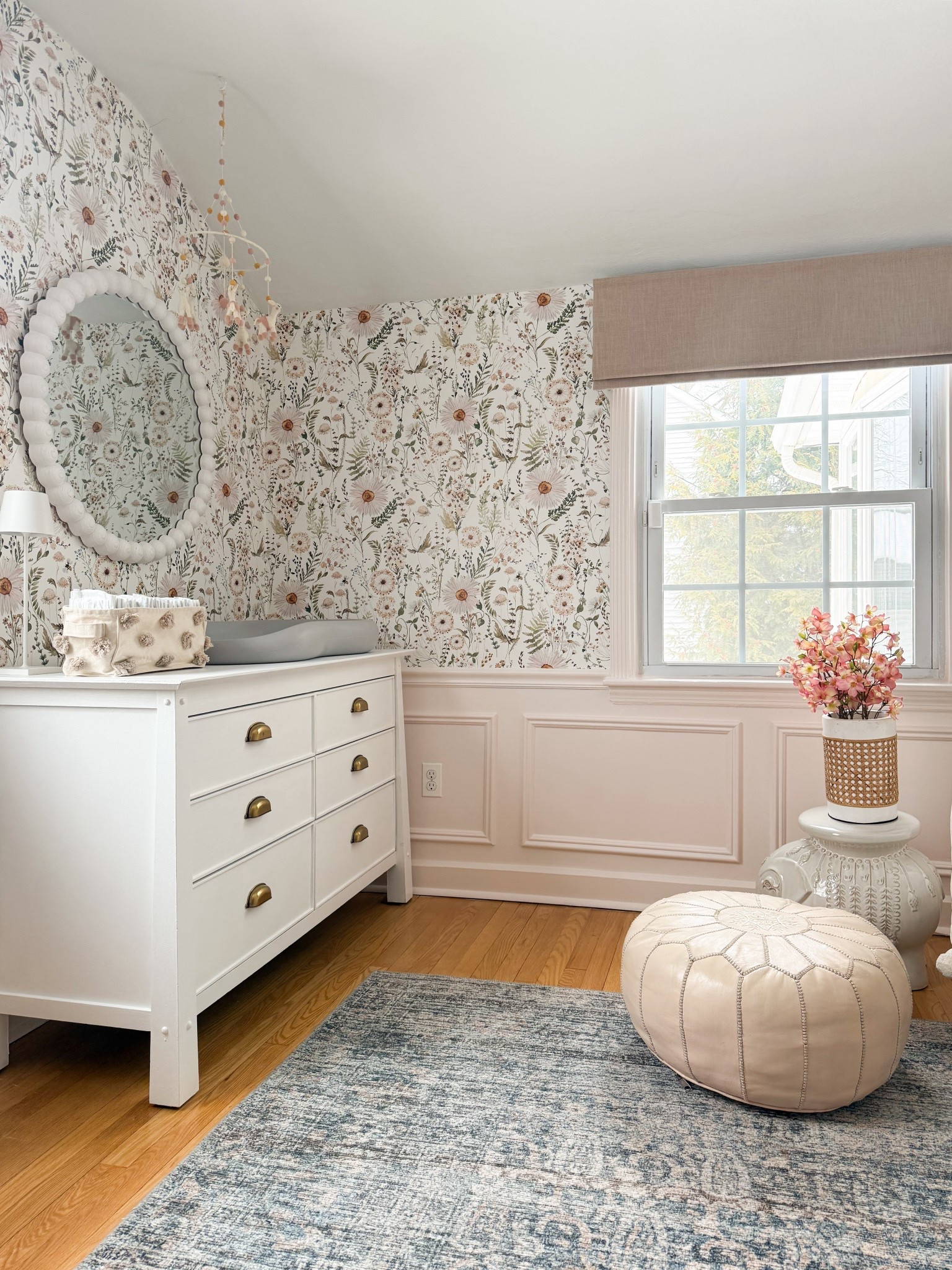 I love how this space brings together so many soft, classic elements without feeling busy. The floral wallpaper adds just the right amount of pattern, the dresser with brass hardware keeps things grounded, and the mobile adds a light, playful detail overhead. Even the pouf and textured accents bring in warmth in such a subtle way that makes everything feel easy and cohesive.

nursery dresser styling, floral wallpaper nursery, neutral nursery decor, brass hardware furniture, nursery mobile ideas, cozy nursery textures, blush nursery accents, vintage style nursery, layered nursery design, classic nursery furniture, soft feminine nursery girlonthehudson

#LTKHome #LTKKids #LTKBaby