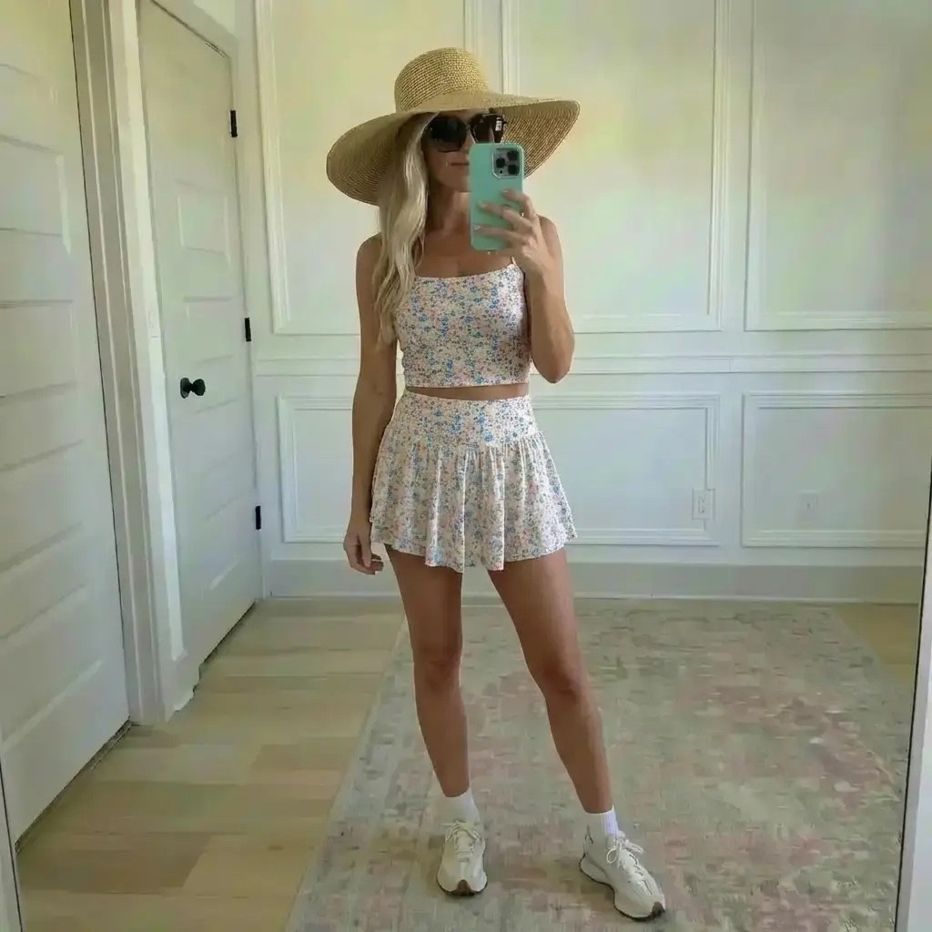 Golden daylight fills a quiet room as she pauses for a mirror moment, wrapped in soft blush tones that feel warm, feminine, and effortlessly chic. A slouchy pink sweatshirt slips off one shoulder, paired with delicate floral bike shorts that hug just right. Finished with classic sneakers, oversized sunglasses, and a wide-brim straw hat, the look feels like spring leisure at its best—equal parts cozy, confident, and ready for sunshine. It’s an outfit made for slow mornings, coffee runs, and pretending you’re on vacation even when you’re not.

Hashtags 🌸☀️

#TrendyHeidi
#TrendyWithAPassport
#SpringStyle
#AthleisureWear
#CasualChic
#SoftPink
#FloralDetails
#EverydayOutfit
#WeekendVibes
#CozyAndCool
#OOTD
#StyleInspo
#EffortlessFashion
#LaidBackLuxury
#SneakerStyle
#MirrorOutfit
#LifestyleBlogger
#SpringOutfits
#ComfortMeetsStyle
#NeutralAesthetic
#WomensStyle
#ActivewearLook
#SunHatStyle
#PinkPalette
#ModernCasual

#LTKdayinmylife #LTKgrwm #LTKValentine