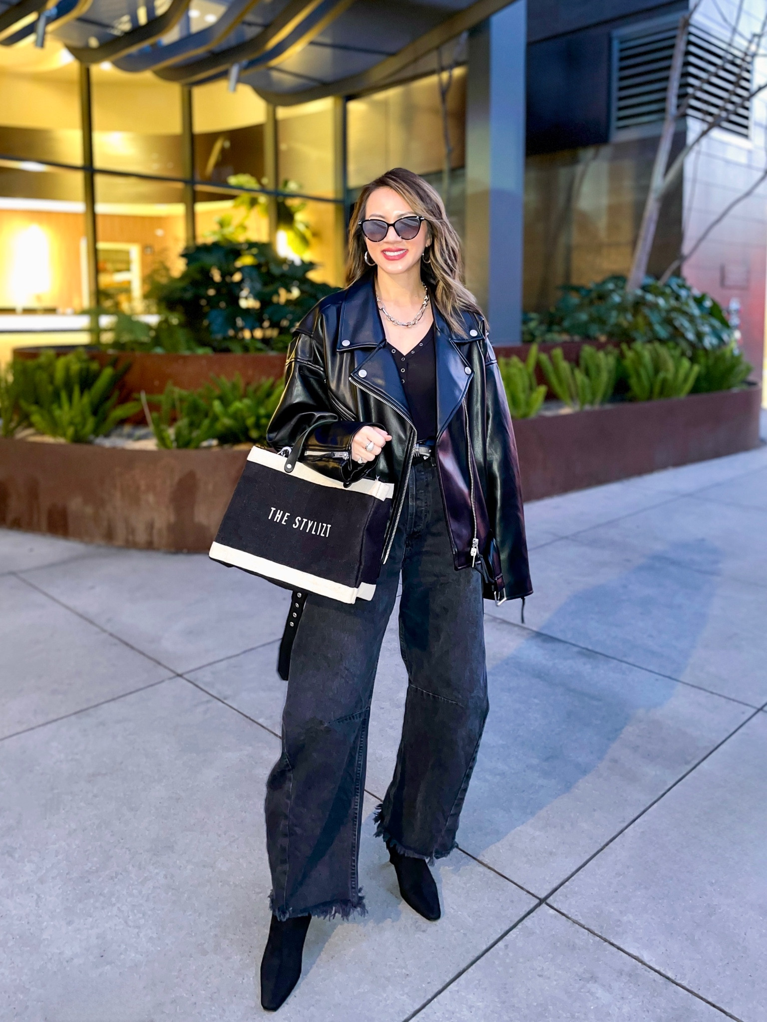 OOTD ⚡️ Loving this oversized leather jacket. Use code: SAVE25 for 25% off. Wearing a size 23 in the barrel jeans—they’re so good! Found them on sale! My bag is also customizable. Loving the blend of style and sustainability. 

Date night outfit, spring outfit, edgy outfit, all black outfit, oversized leather jacket, barrel jeans, horseshoe jeans, henley shirt, booties, burlap bag, Apolis, The Stylizt 




#LTKstyletip #LTKsalealert #LTKitbag