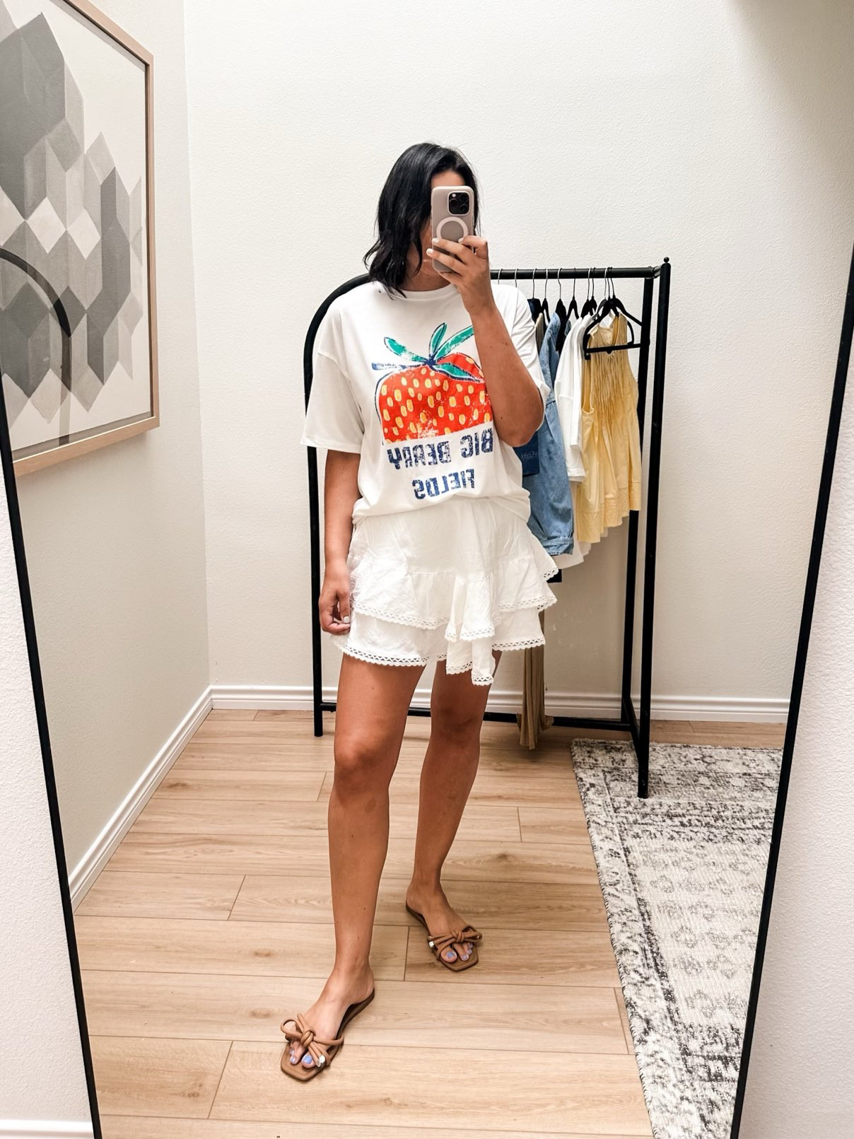 Here is the other graphic tee! Super cute right? VERY soft – softer than the other one. I think I like the other one more but what do you think? I do love the graphic and the shape and fit. I’m trying to decide if it’s worth a keep. Also it’s one size so for some of you this might end up being way oversized! For me it fits like a large.

This skirt is a bit of a wild card but I love it. It includes shorts underneath – cotton shorts that fit tighter than the skirt which I don’t love but I am glad something is there. The skirt is shorter but with the shorts underneath I feel protected. 

I am on the fence on sizing – I got the medium and it fits great. The inner shorts are a tighter fit and that’s the only thing I would say to size up for. Just for comfort, basically. 
 

 