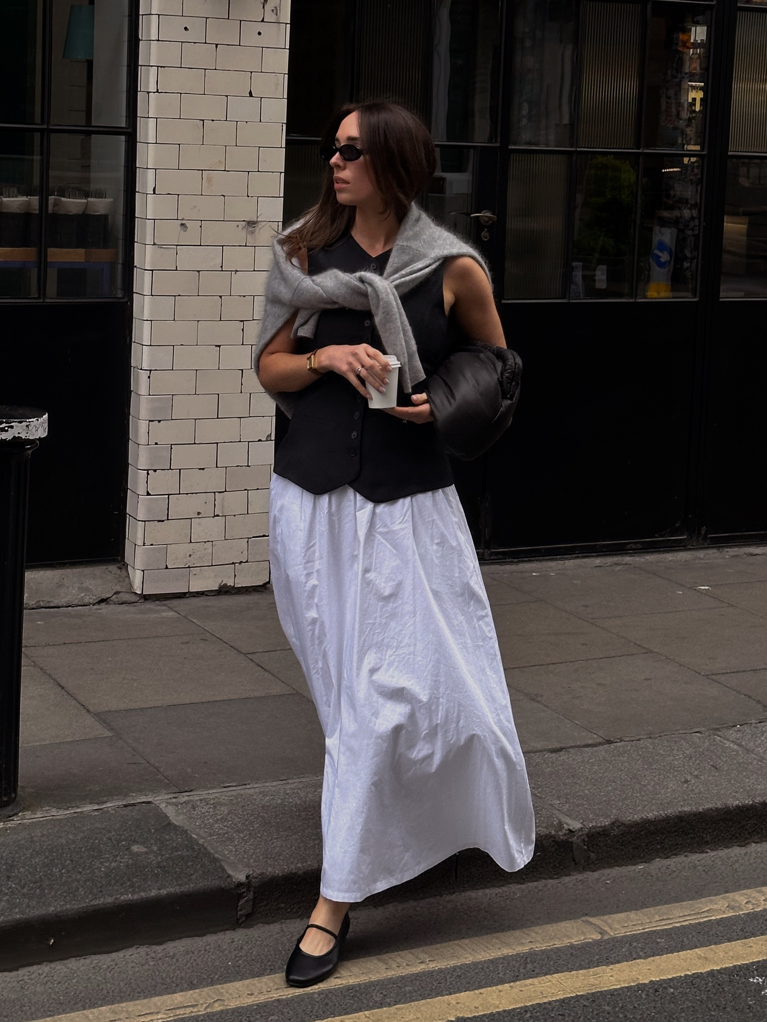 Long white skirt, Mary Jane ballet pumps, waistcoat, grey cashmere knit, oversized clutch, Le specs sunglasses, 

#LTKfindsunder50 #LTKshoecrush #LTKstyletip