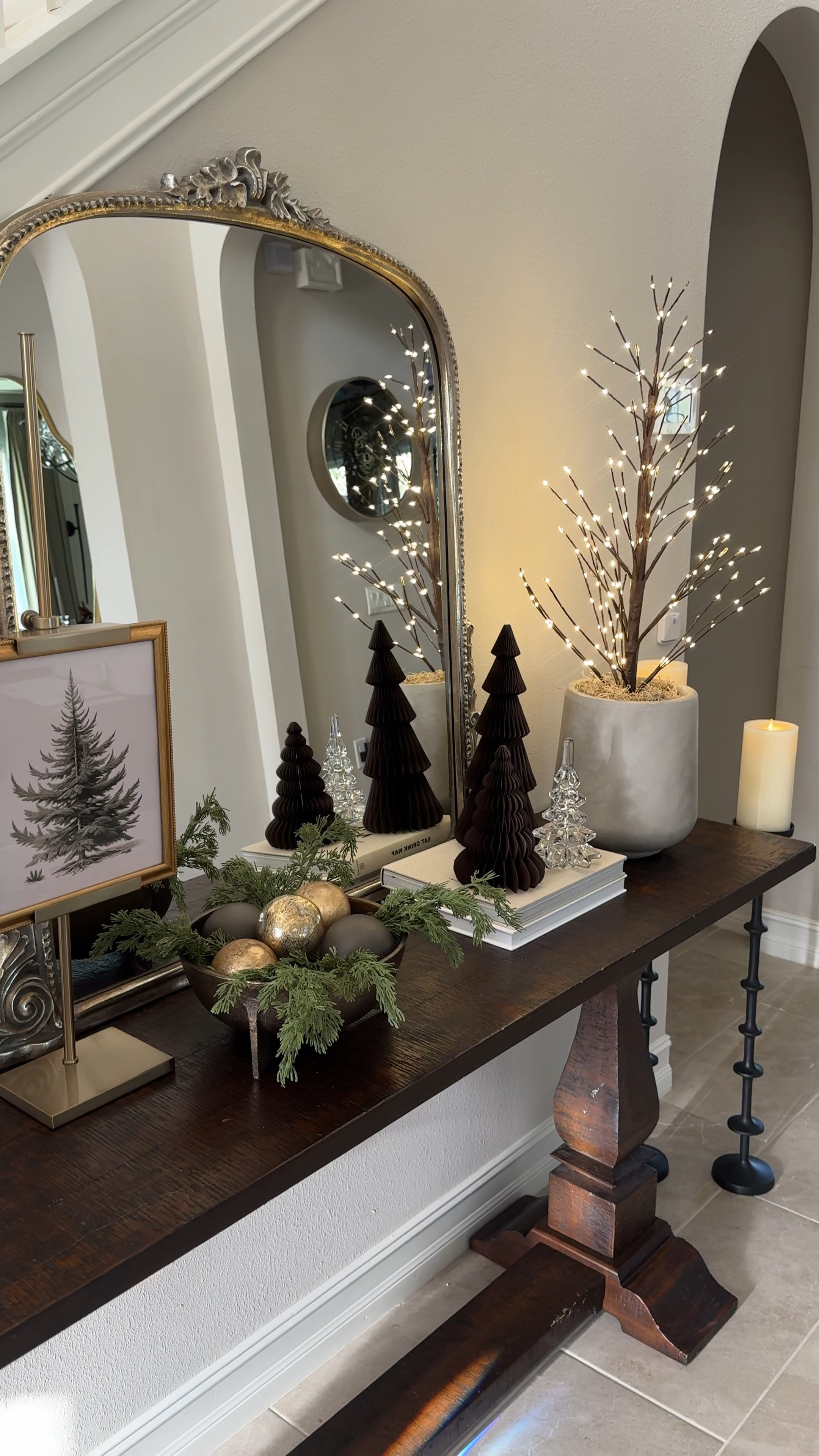 I’ll probably change my holiday console table 5 more times before Christmas but I’m currently really loving this look! The tabletop twinkling twig tree is such a Christmas decor staple for me. I love these floor candleholders as well. I switched out the art in my tabletop easel and I love the look!

#LTKVideo #LTKHome #LTKSeasonal