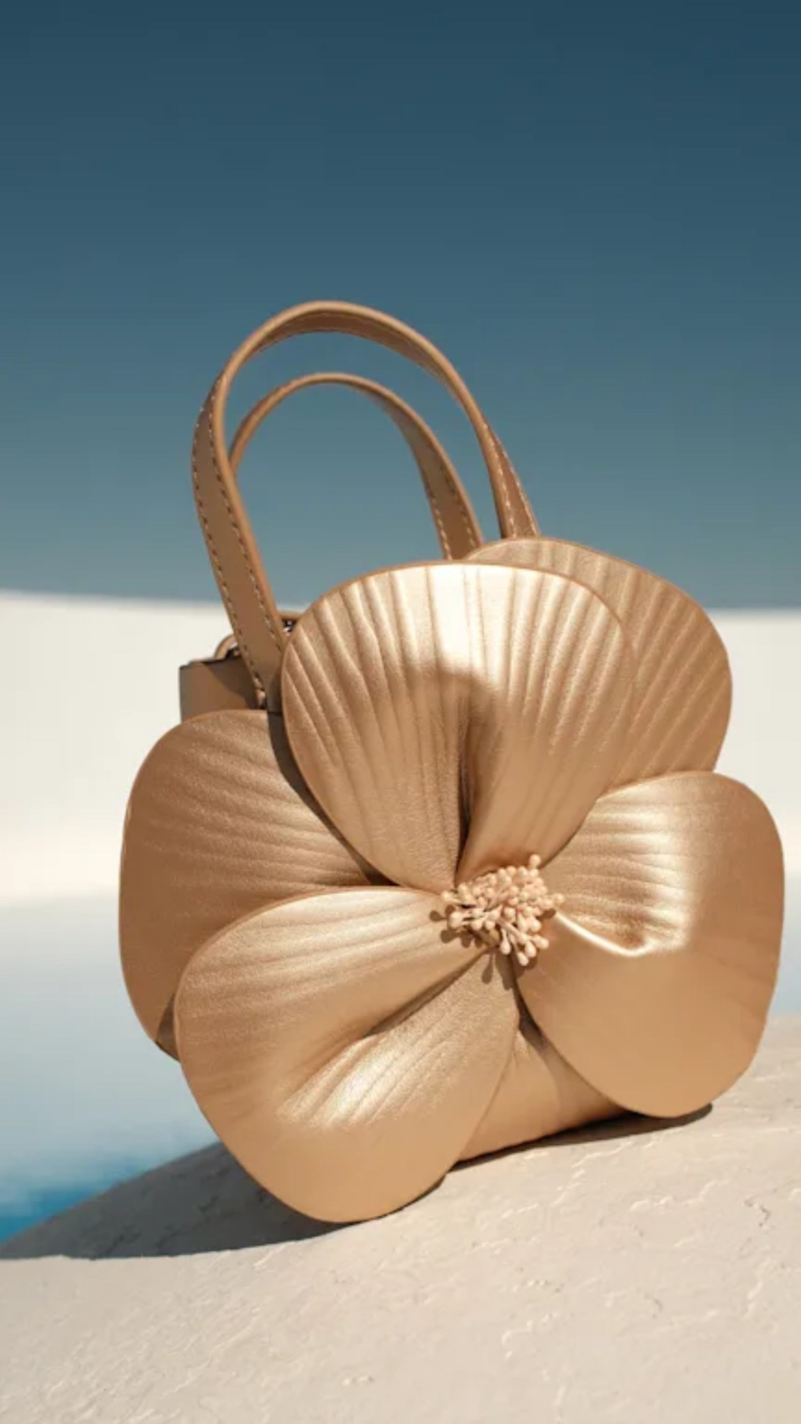 Stunning gold flower bag under $50! 

#LTKItBag #LTKStyleTip #LTKFindsUnder50