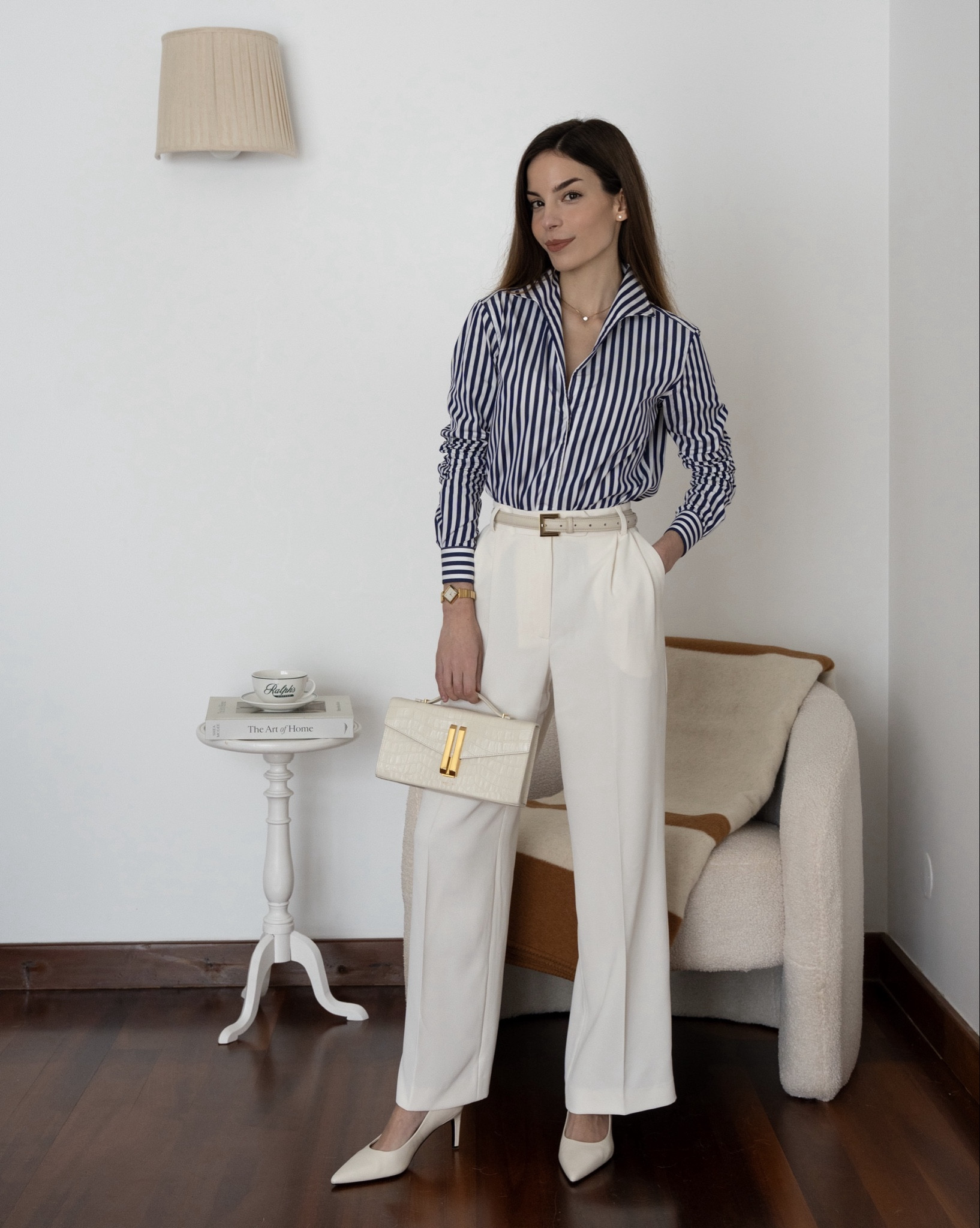 My go-to classic spring look! A navy and white striped shirt paired with white tailored trousers and styled with neutral leather accessories.

#LTKootd