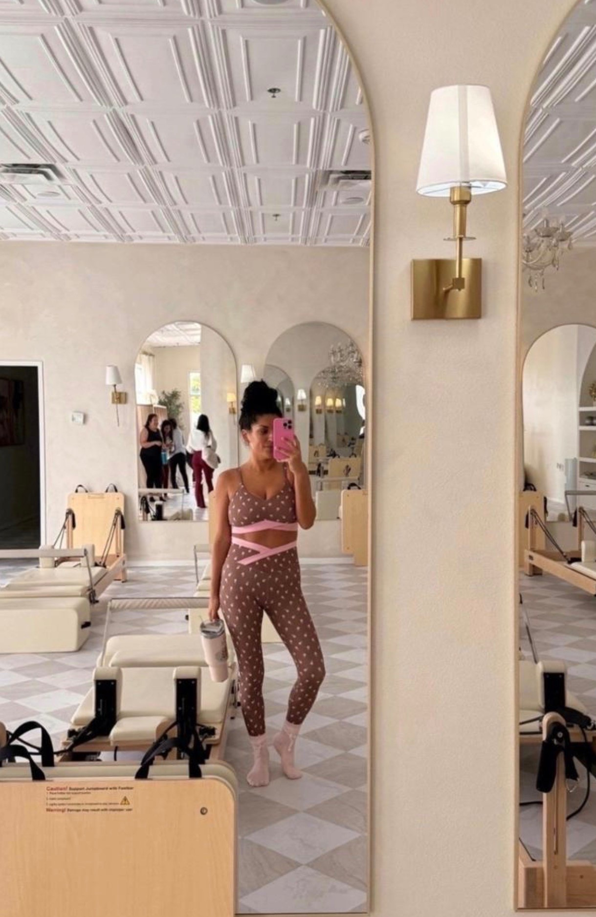 Pilates, but make it cute 🤎🎀 This printed activewear set with soft pink details is the sweetest mix of sporty and feminine for a studio workout.