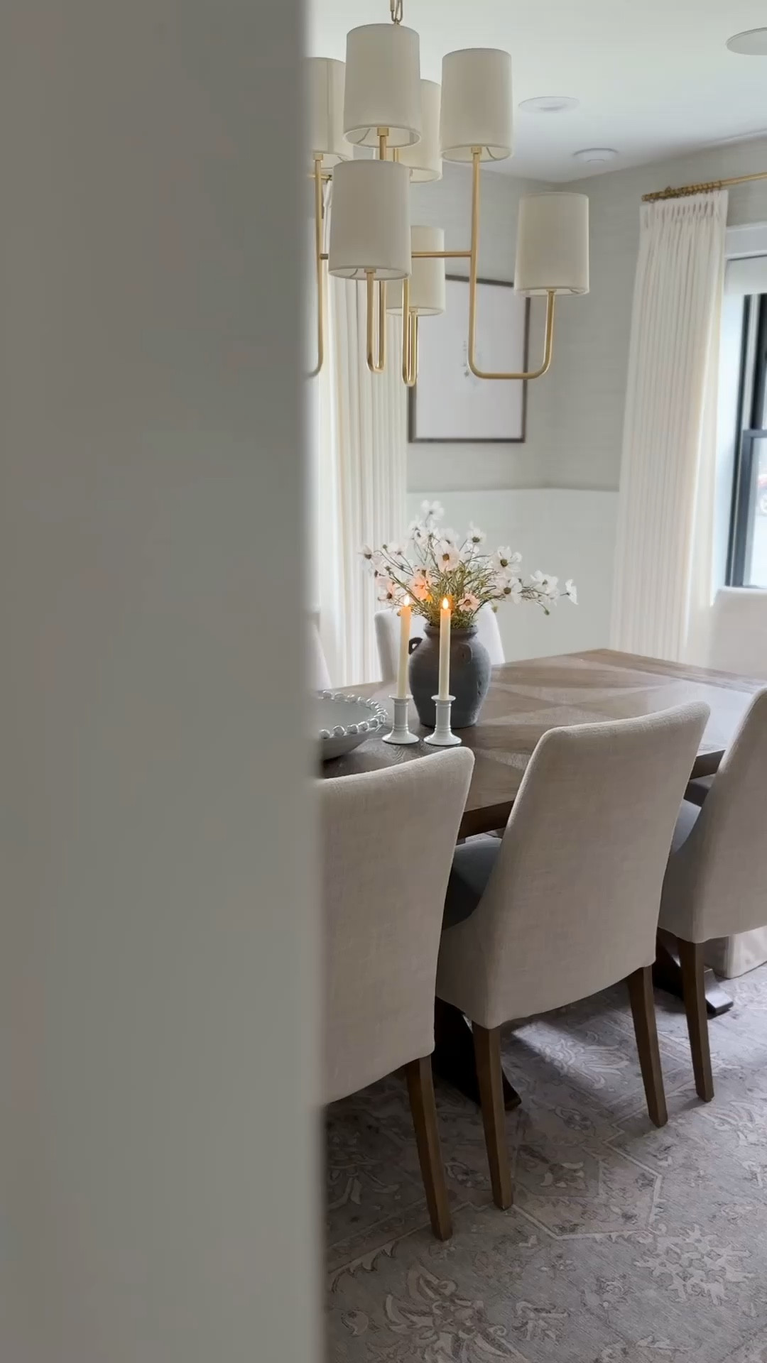 Dining room design, dining room inspo, traditional design, grasscloth wallpaper, wainscoting, neutral dining room, gallery frames, Studio McGee, McGee & co, dining table centerpiece, gold dining chandelier, wood trestle table, upholstered chairs, affordable finds, tjmaxx finds, marshalls find, look for less, dining room, high end look for less, serene, calm, family friendly, Benjamin Moore Simply White paint, washable rug, dining room rug ideas, transitional design, traditional home, high end look for less, affordable finds

Curtain Details:
TWOPAGES Isabella Custom Curtains
Color: Off White/Creamy White 7084-5
Hanging Header Style: Triple Pleat
Width: 75" wide
Length (Height): 90” long
Lining: Room Darkening Liner, 140GSM
Body Memory Shaped: Yes
Hardware Details:
Finish: Brass
Diameter: 0.75”
Rings: 0.75” (1 1/2” diameter)


#LTKStyleTip #LTKFindsUnder100 #LTKHome