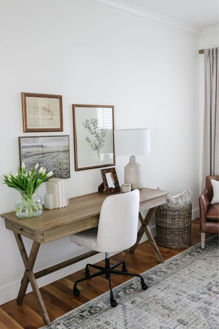 In my office I have a World Market wood campaign desk with a Pottery Barn upholstered desk chair. Above the desk I hung a small gallery wall of artwork. 

#LTKhome #LTKSeasonal #LTKstyletip