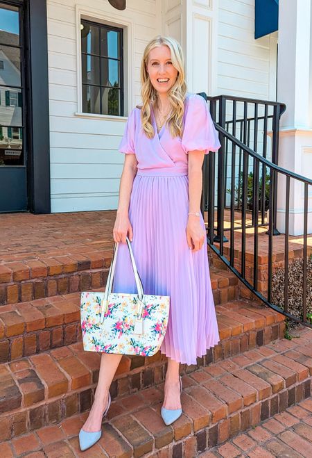 The perfect dress for spring or Easter! Lavender purple pleated dress with balloon sleeves. Surplice criss cross front, midi-maxi length. Fits TTS. Floral purse.

#LTKfindsunder100 #LTKSeasonal #LTKitbag