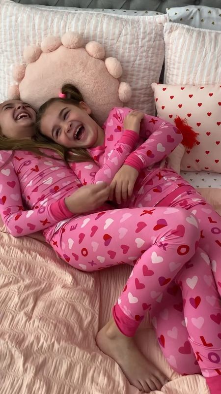 These 2 giggle boxes are having the best morning together. #ad Staying comfy & cozy in their new @littlesleepies PJs. 

We love how soft and long lasting these jammies are. The candy pink XOXO print is perfect for Valentine’s Day. 💗


#LittleSleepiesPartner #pajamas #kidsclothes #pjs #valentinesgift #valentines #sisters #matchingfamily #matchingpajamas #lovebasket #loungeset 

#LTKfamily #LTKkids #LTKfindsunder50