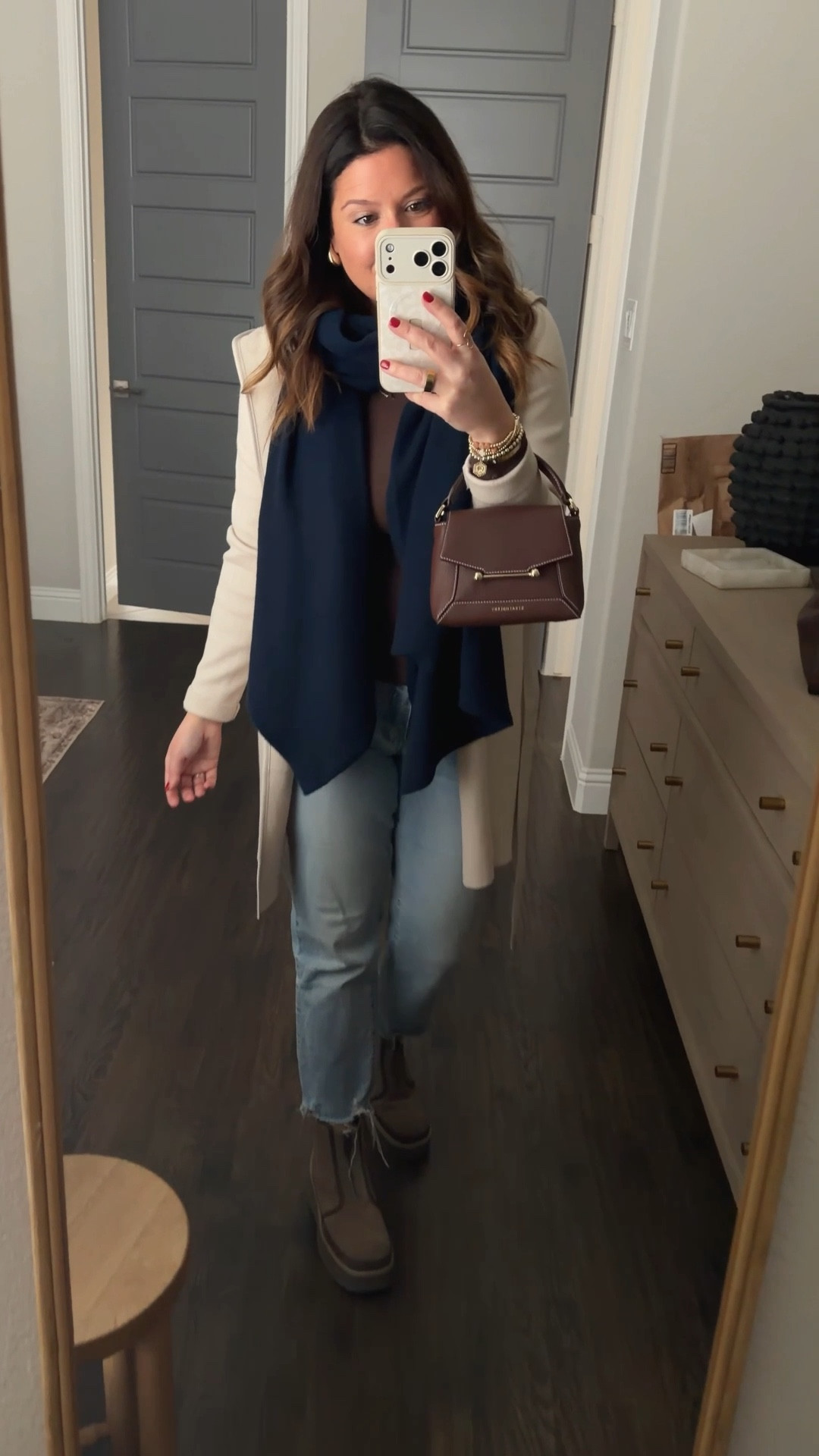 Help me pick a bag to wear today!! I’m headed to my first ever mammogram (not excited!) and this is my OOTD. Still trying to decide on which brown purse to wear. What do we think? The Strathberry Mosaic (obsessed, have it in two color-ways) or The Horse Clementine (also LOVE-so roomy and the leather is perfectly soft and yummy!) 🤎🤎🤎🤎 Scarf is 100% cashmere from Macys and the navy color is PERFECT! It literally matches everything! Would be great as a travel shawl too bc it’s a little oversized. My boots are on sale right now at DSW!! They’re Ugg, so comfortable, water repellant, and fit TTS. 

#LTKgrwm #LTKselfcare #LTKWorkwear