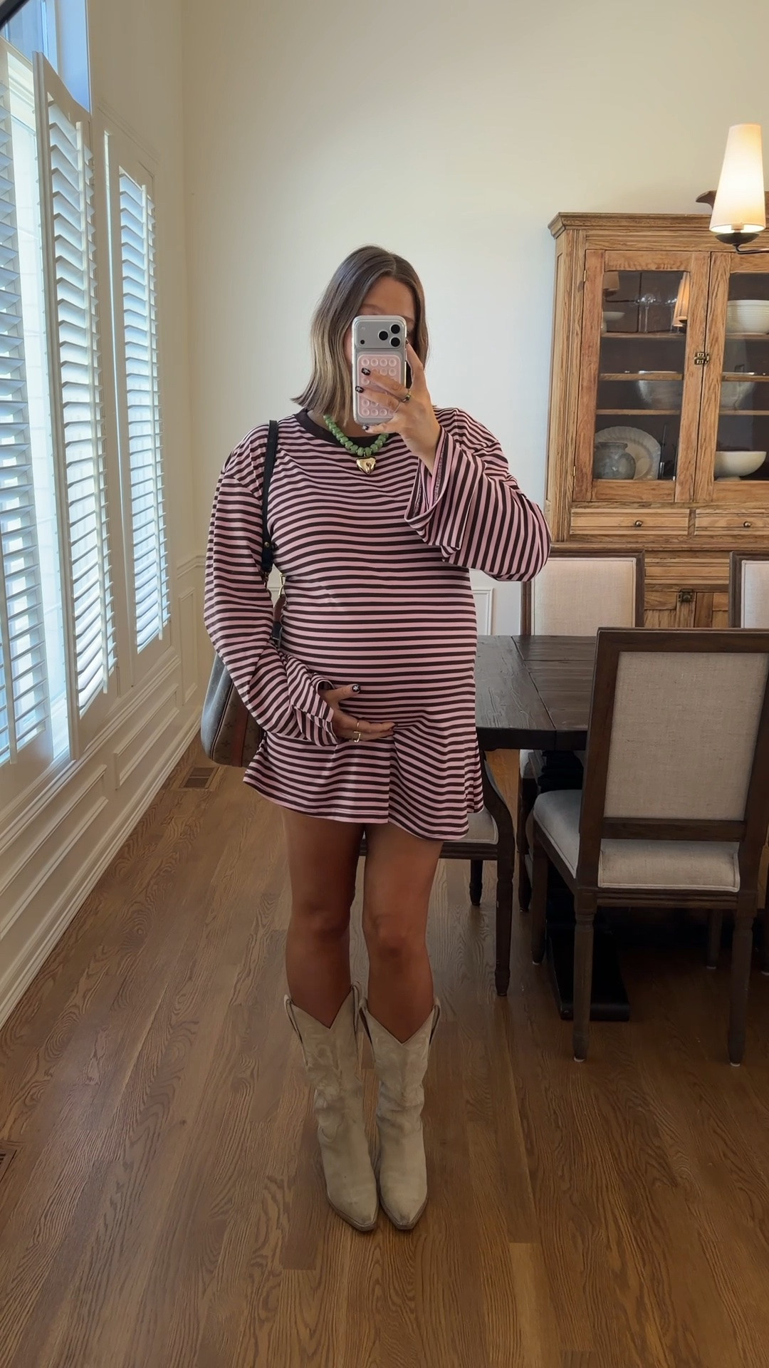 Dress restocked 💓💓size 10 I’m 5’ 5” and it’s such a perfect length!! If I wasn’t pregnant I would do an 8. Stick with true size. Boots true to size probably my most worn cowboy boots ever!! Amazon necklace for a pop of color 

#pregnancystyle #bumpstyle #stripeddress #bresheppard #princesspolly