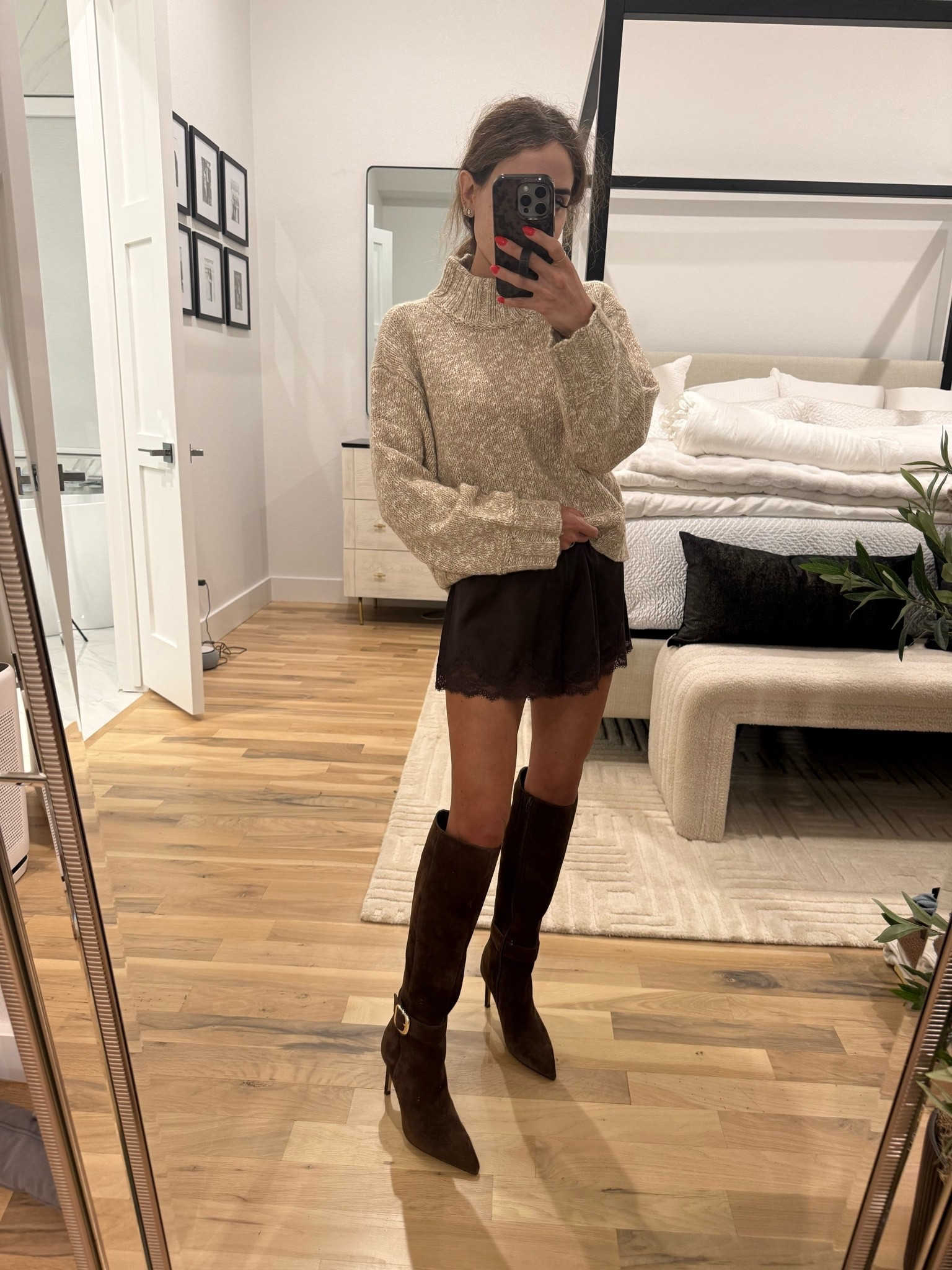 Neutral sweater with brown lace shorts and brown suede boots. Fall outfit idea
