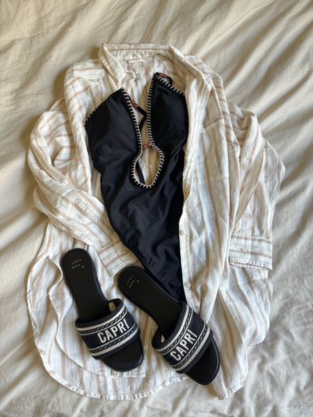 I've been living in these summer basics for spring break. This Aerie linen coverup looks so cute with all my suits. And these Steve Madden dupes from Target are my go to summer sandal. 

Shoes 6.5 TTS / suit xs / shirt / xs 

Pool coverup  / aerie / target fashion / target swim / black swimsuit / one piece swim suit / target style / spring break style / summer sandal / target sandal 