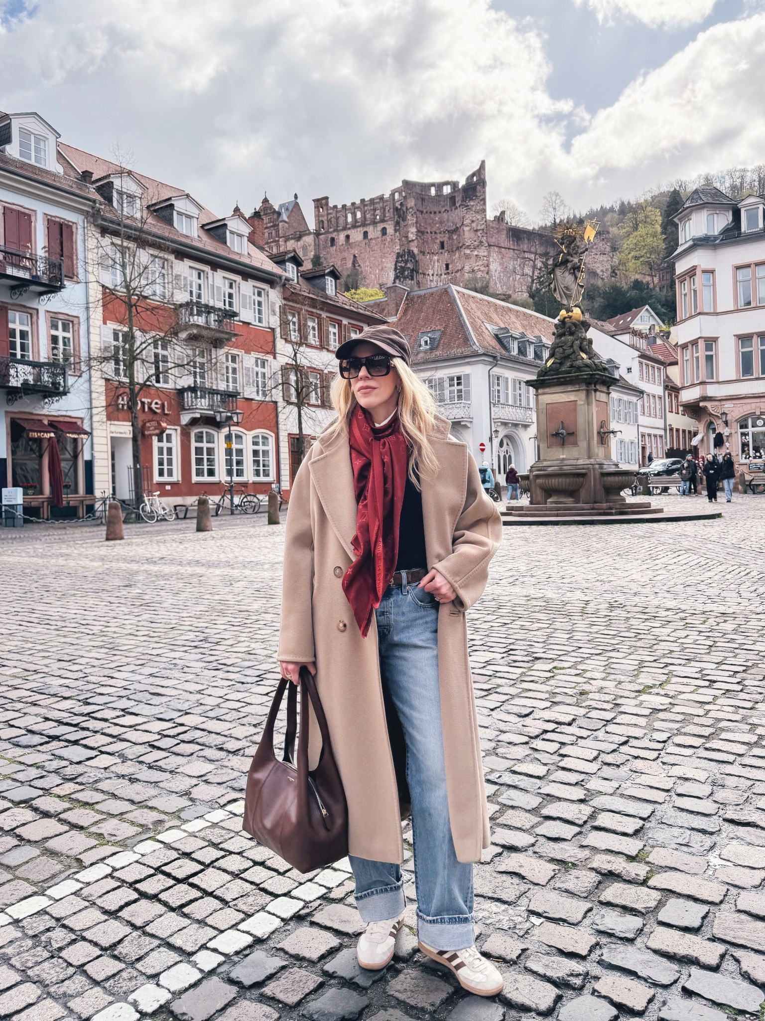 Spring travel look, European vacation style, camel coat, red Louis Vuitton scarf, @Levi's baggy 90’s jeans, mahogany brown leather handbag, brown Adidas Samba sneakers 

#LTKSeasonal #LTKTravel #LTKSaleAlert