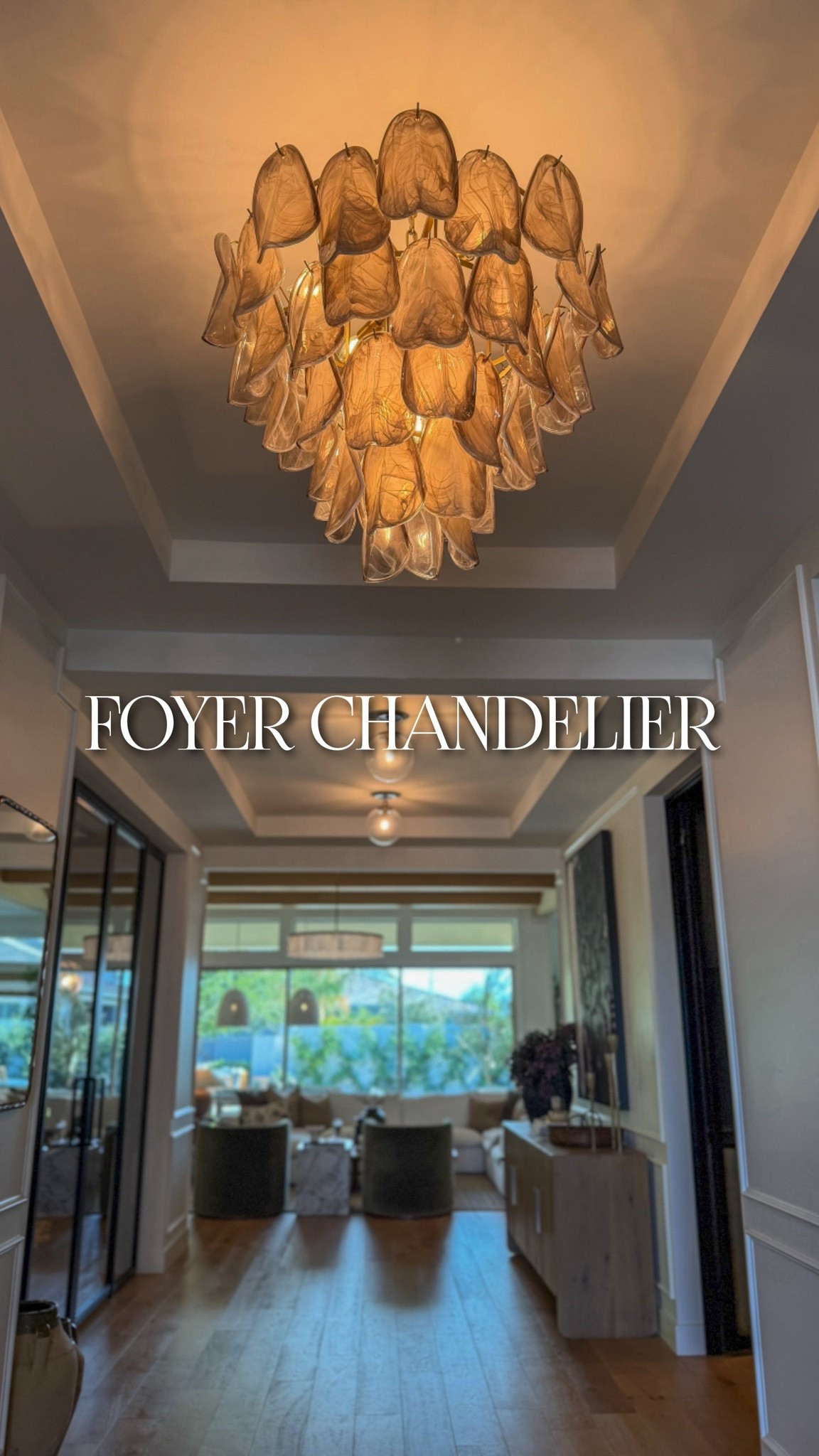 This stunning chandelier from Lulu and Georgia completely transformed our entryway. Its layers of smoky, artisan crafted glass petals add so much warmth and movement to the space, while the antiqued brass gives it the most beautiful vintage inspired finish. I love the soft shimmer of the glass, even when the light is turned off. Plus the dimmable feature lets us create just the right atmosphere throughout the day and evening.
@Lulu and Georgia

#LTKHome #LTKdayinmylife #LTKSeasonal