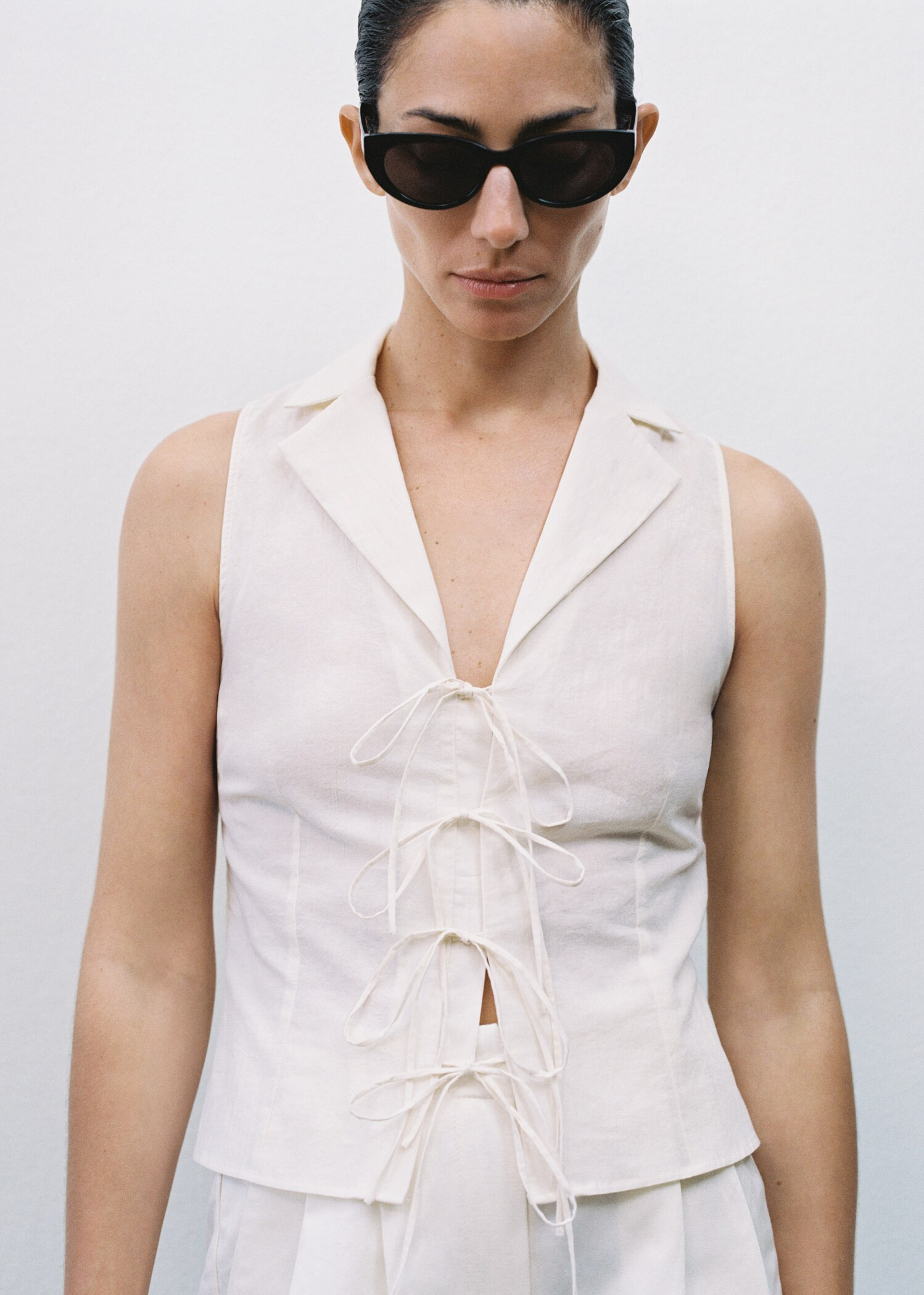 Sleeveless blouse with bows | MANGO (US)