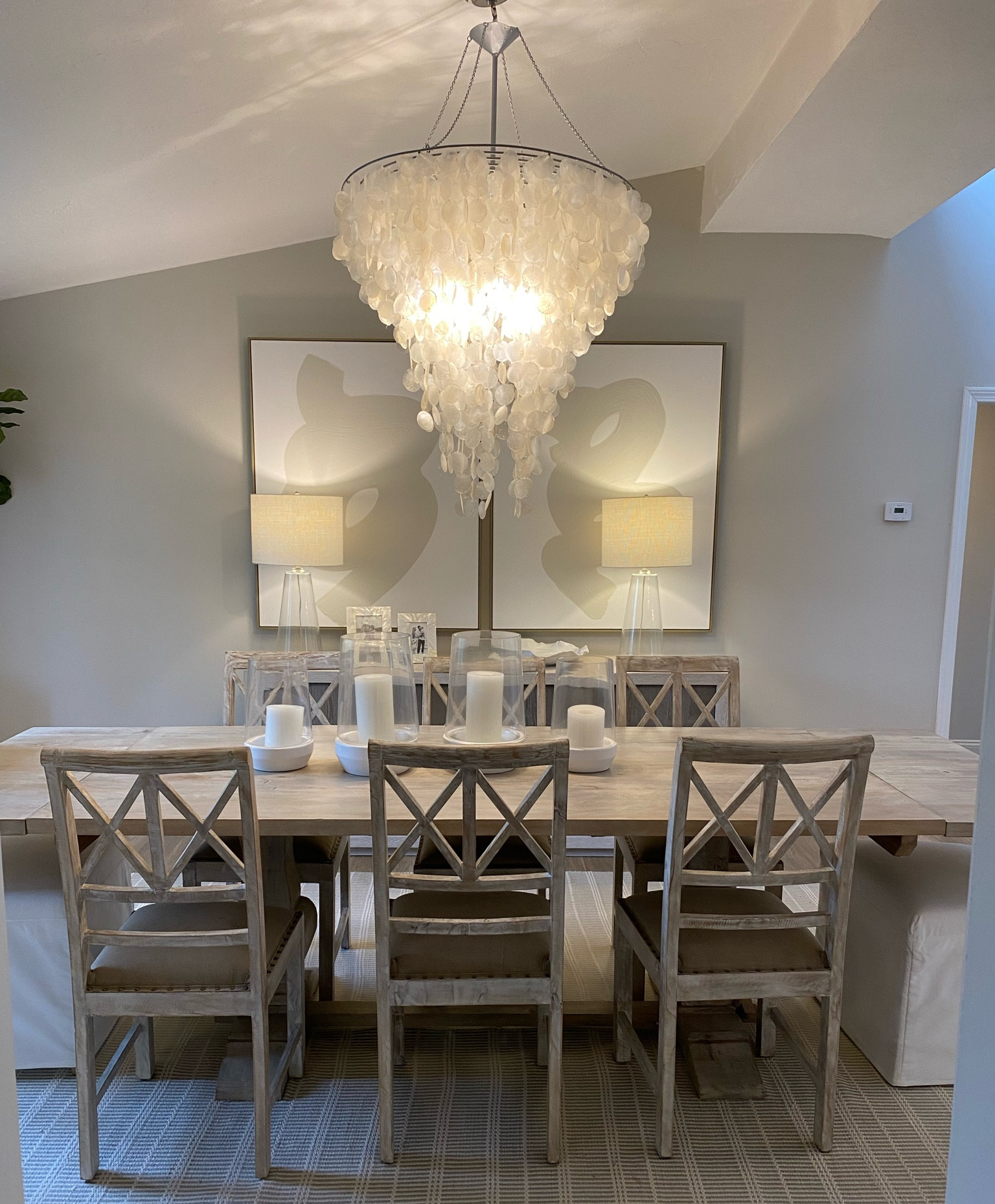 Dining Room Home Decor 

Dining room decor, neutral home decor, neutral style, white artwork, paintings, diptyque art, large shell chandelier, large white chandelier, hurricane candles, glass table lamps, dining room table, neutral indoor/outdoor rug, modern dining room, buffet table, console table, faux tree, large white pot, neutral artwork, neutral home style, modern home decor, table, whitewash, dining room inspo, white end chairs, large artwork, neutral artwork, neutral home style, neutral decor, neutral rug, console table, side lamps, tabletop accessories, hurricanes, faux trees, studio mcgee, modern home style