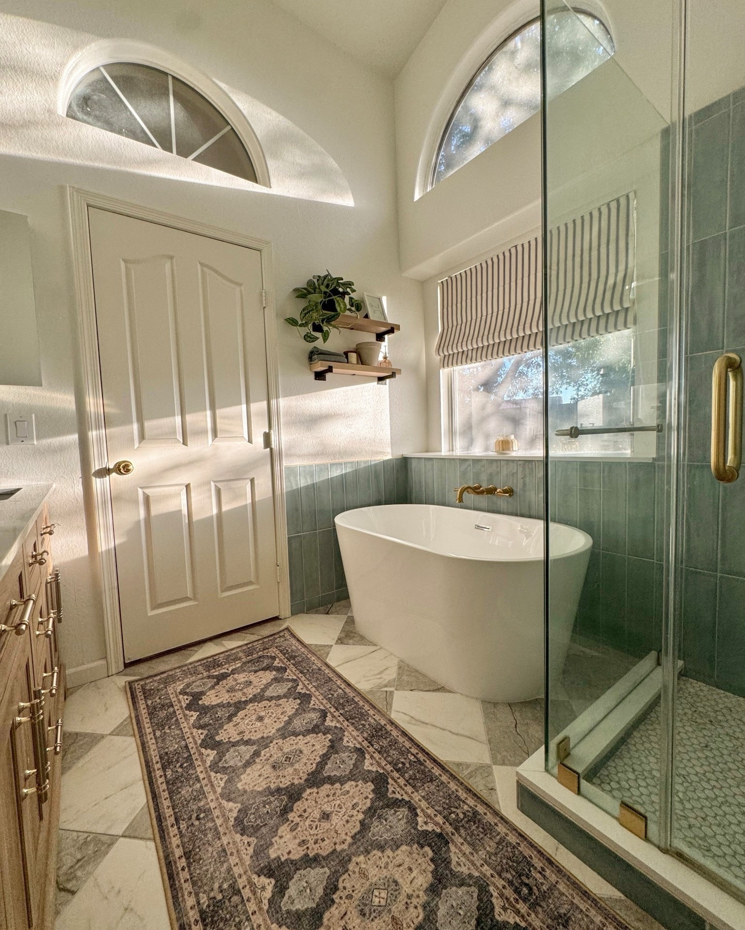our primary bathroom remodel. checkerboard tile, standing tub, whimsical turquoise shower tile & fun mix of patterns. bathroom runner rug is washable too! 

#LTKHome #LTKmomlife #LTKSeasonal