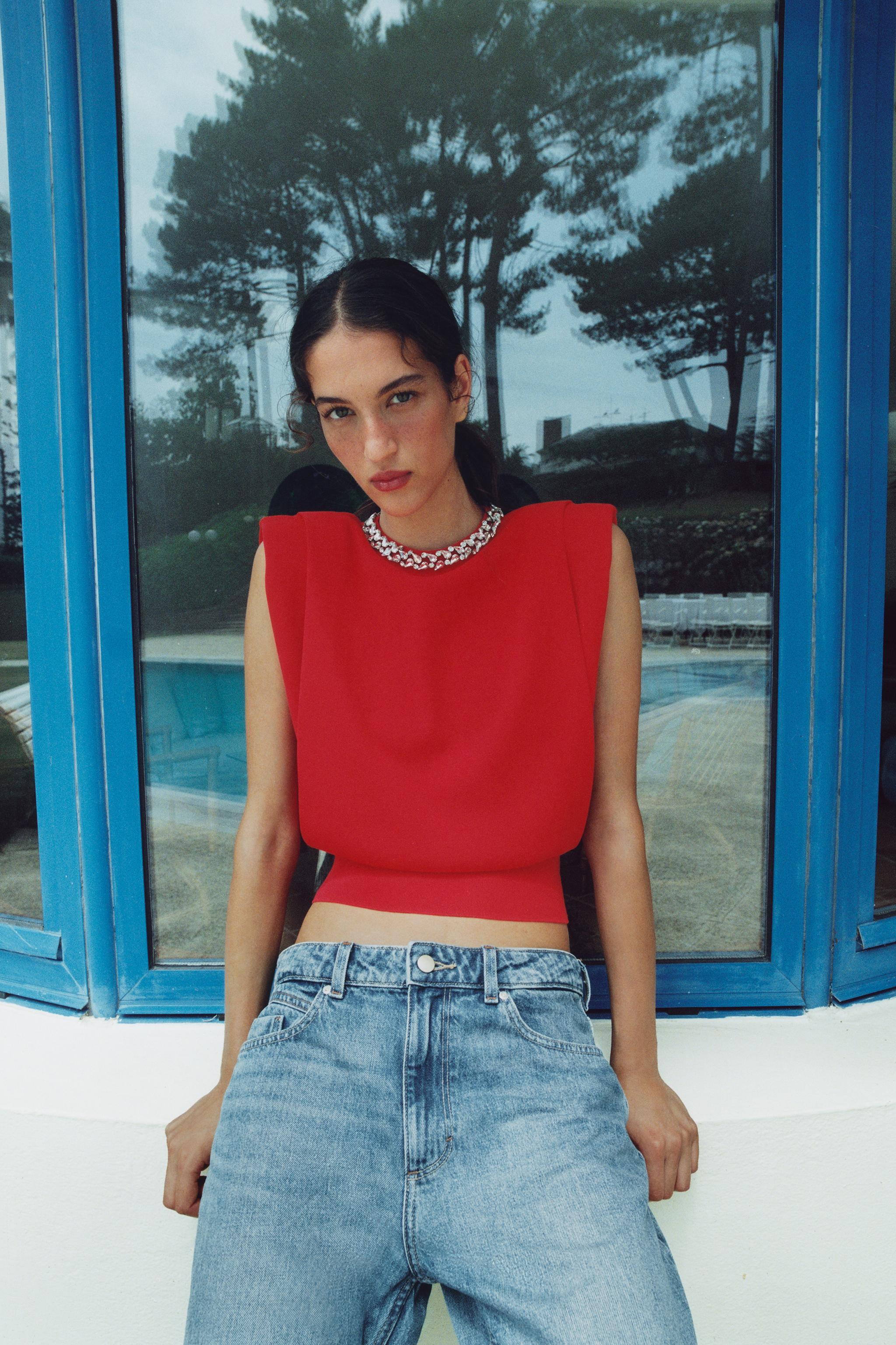 Sleeveless round neck top with shoulder pads. Features jewel appliqu\u00e9 detailing at the neckl... | Zara US