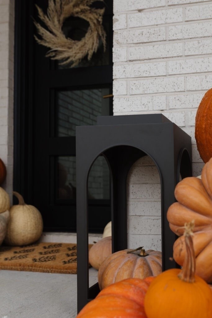 Fall front porch decor with similar lanterns, faux pumpkins and real ones! Love this for the season

#LTKHome #LTKSeasonal