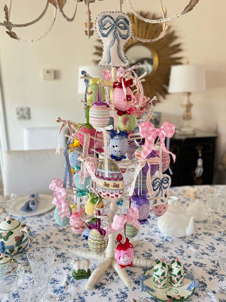I present to you… my Easter egg tree. I have been saving and working toward this tree for many years now. I think my vision is complete! I finished my large 13 mesh needlepoint bow into a tree topper. It’s the bow🎀🍒🎀 on top of my smocked egg tree! 
Smocked eggs are a collection from @theclassicbaby and an estate sale find. 🐇🥚🎀🥚🐇
Do you have an Easter tree?

Eleven Gables needlepoint bows can be found at @stitchstyleblog 

#eastertree #needlepoint #grandmillennial #smocking 
@victoriamagazine

#LTKSeasonal