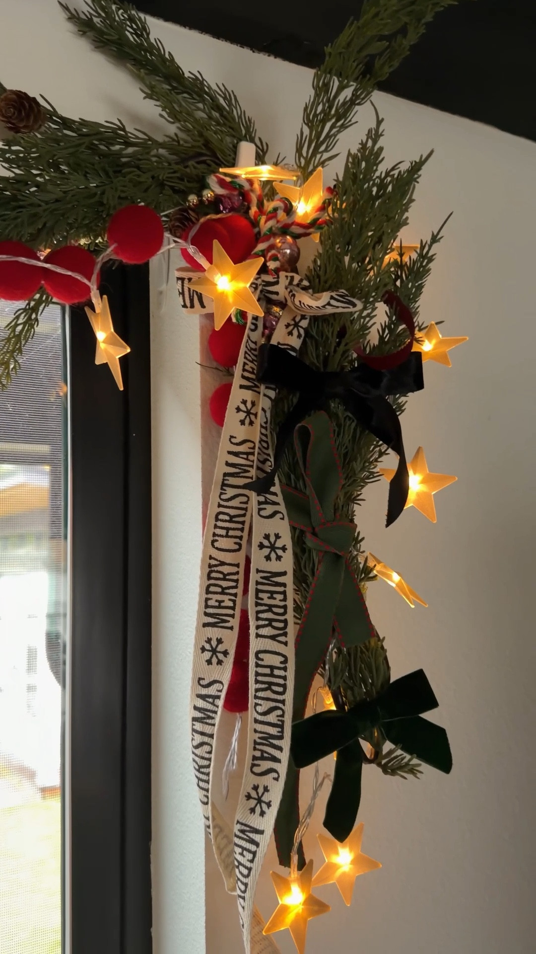 Here’s how I made my swag above my kitchen windows: 

I got my garland from home goods but u linked a similar less expensive one from target. The felt balls I strung myself but you can find so many pre made fun Christmas garlands this time of year. Add all the garland, lights, and pre strung things… then go ham with ribbon tying it all together  