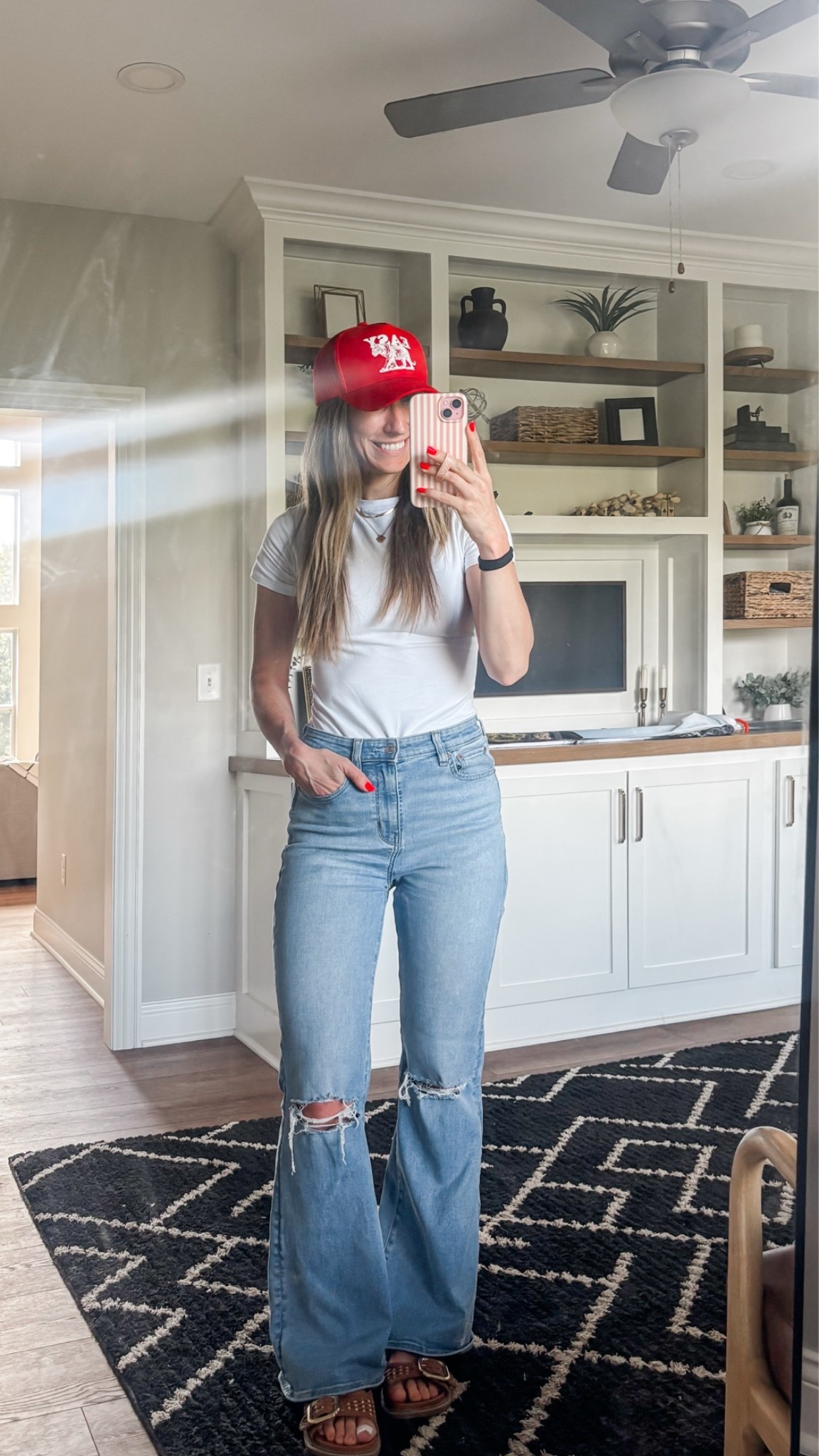 Today’s running errands fit. Shirt has a built-in bra!! 

Flare jeans | trucker hat | mom outfit