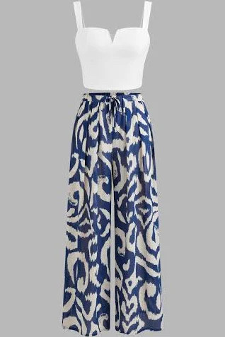This outfit looks like it belongs on a Mediterranean vacation. 💙

The structured white top paired with the bold blue printed pants creates an effortlessly chic look that's perfect for dinners, cruises, and summer getaways.

#LTKStyle #VacationStyle #ResortWear #SummerFashion #FashionFinds
 

 