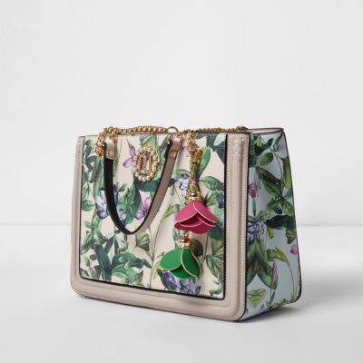 Cream floral leaf print flower charm tote bag | River Island (UK & IE)