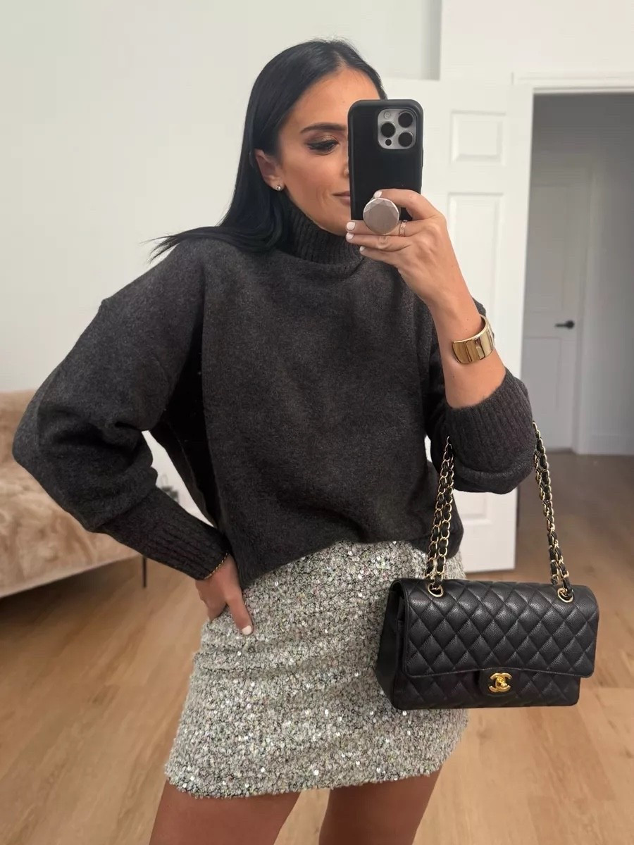 soft knit high neck jumper wearing size small. Sequin mini skirt wearing size medium.

