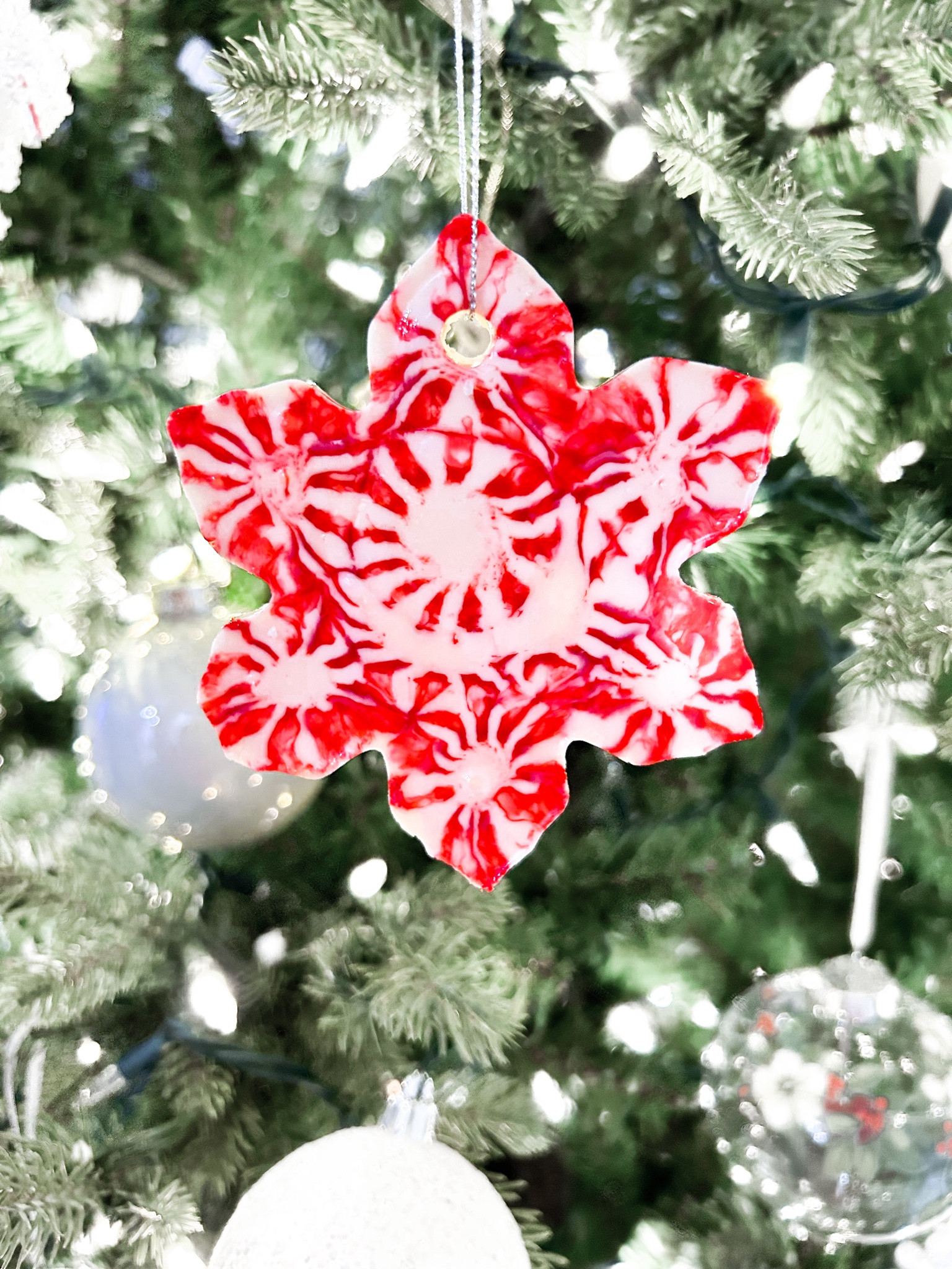 Homemade Peppermint Candy Ornaments

✨TIPS ✨
- Less is more when you spray the inside of the cookie cutters with cooking spray.
- It took exactly 8 minutes for these to melt in my oven, but I would start watching them at 5 minutes.
- Any cooking oil works on the end of the skewer. I used Olive Oil.
- I waited exactly 2 minutes after taking these out of the oven before making the ribbon holes. If you try to do it too soon, the hole will fill back in. Wait too long, and the candy will fully harden.
- These only last for one season. However, it’s an easy and fun tradition to make these every year.

#LTKFamily #LTKHoliday