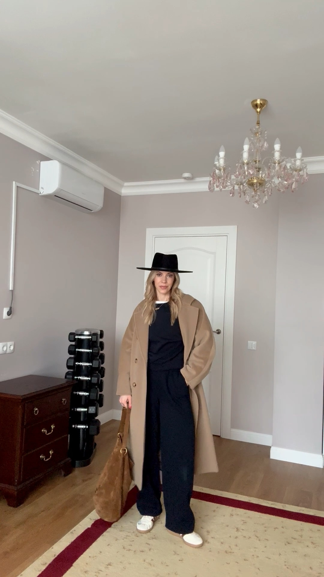 Chic travel outfit, airport look, @Zara navy sweatsuit, camel coat, @Janessa Leone black wool hat, Adidas Samba sneakers, suede YSL bucket bag

#LTKTravel #LTKSaleAlert #LTKSeasonal