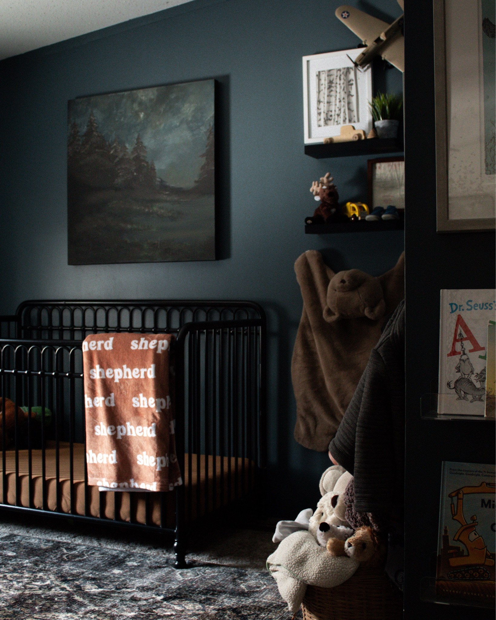 Walls are SW Rain Cloud
Bear play mat on the wall is old PB Kids. Linked similar 
Art above the crib was custom

Moody baby nursery. Blue baby nursery. Baby boy nursery. Traditional boys nursery. Navy blue bedroom. Vintage baby boy nursery 

#LTKhome #LTKbaby #LTKfamily