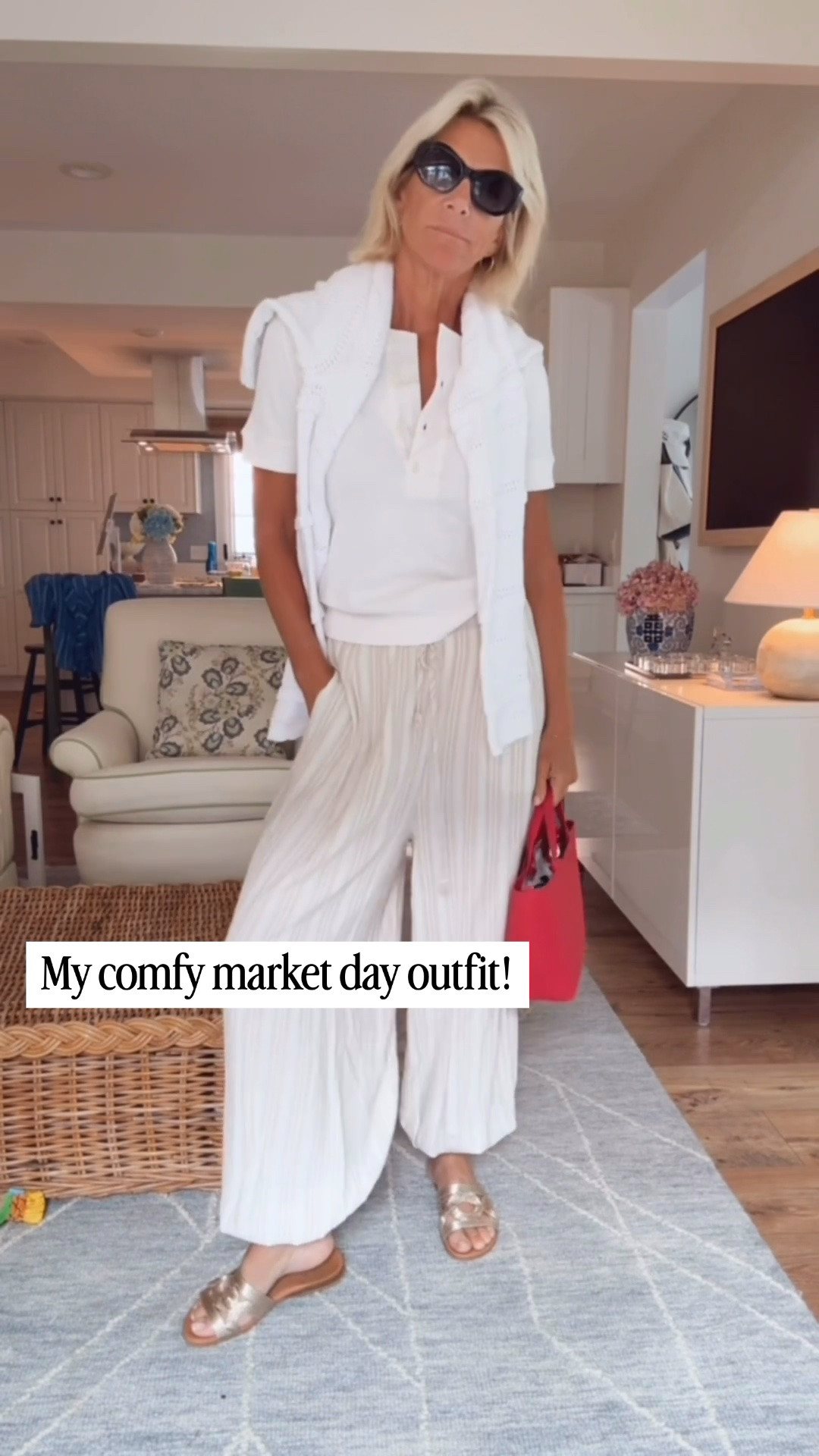 An easy market day outfit that’s equal parts comfortable and polished. These flowy wide-leg pants, a classic white tee, lightweight sweater, and metallic sandals are effortless for errands, lunch, or a morning at the farmers market.

👩‍💻 LTK PRO TIPS
❤️ Heart = Support my posts ;-)
🔖 Save = Get sale & restock alerts for the things you love!
📋 Lists = Keep favorites organized (List ideas: Christmas, Birthdays, and Vacations!)
📲 Share = Send lists and products to a friend (or your daughters like me).
💬 Comment = Ask me anything, and I’ll answer. ;-)

#LTKootd #LTKgrwm #LTKOver40
