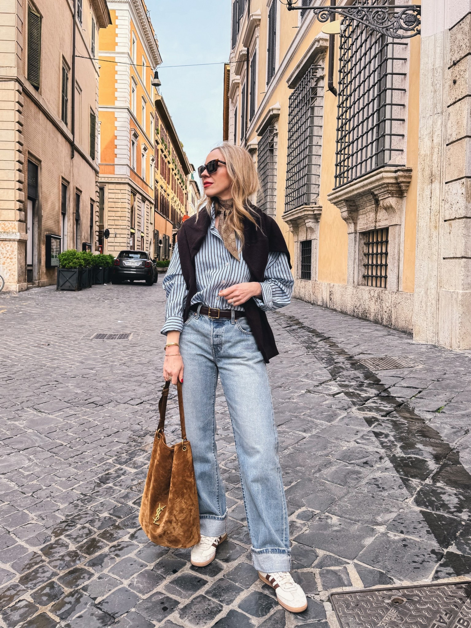 Spring outfit, @Zara striped blue shirt, @Levi's cuffed 90’s jeans, travel look, Adidas samba sneakers, YSL suede bucket bag

#LTKdayinmylife #LTKSaleAlert #LTKTravel