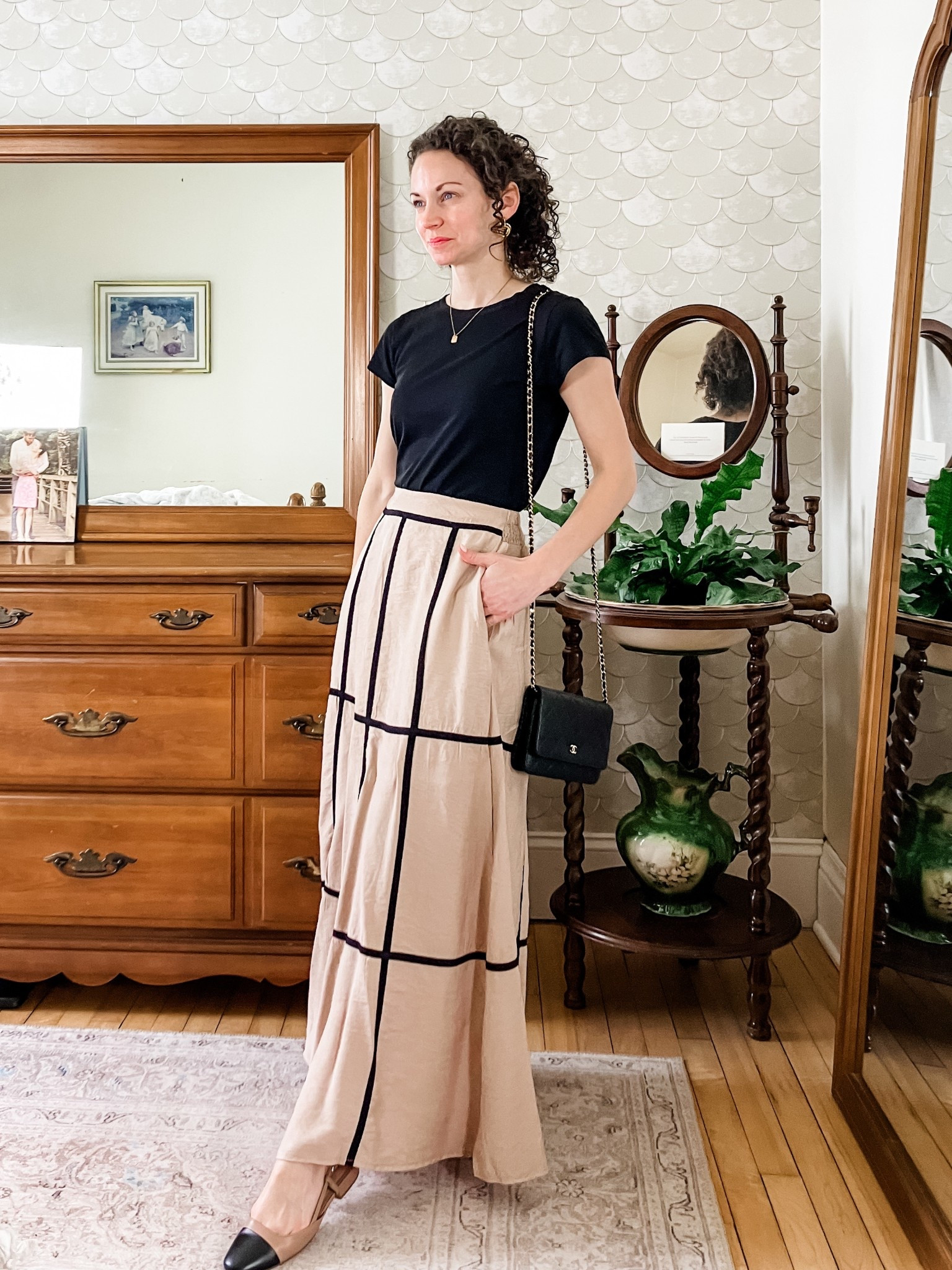 The cutest spring skirt from Amazon!
Black T-shirt from Loft. 
Beige and black maxi skirt from Amazon. 
Gold door knocker earrings are from a local boutique, linking similar. 
Gold and diamond personalized necklace from Oak and Luna. 
Black leather bag from Chanel. 
Flats from Steve Madden. 
Modest outfit. Spring outfit. Classic outfit. Neutral outfit  

#LTKPetite #LTKOver40 #LTKmomlife