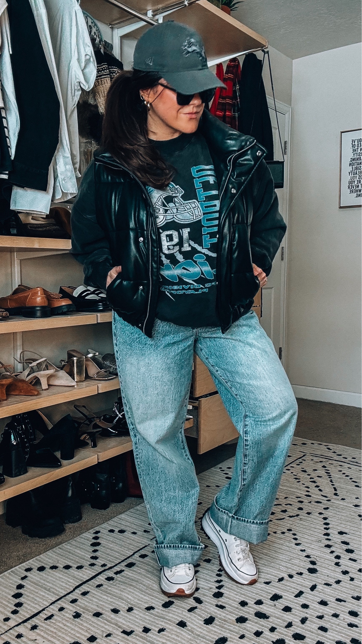 Midsize game day outfit idea. 
Comfy sweatshirt xl 
Faux leather puffer vest large 
Converse high tops tts 
Wide leg jeans wearing a 33 midsize 


#LTKstyletip #LTKSeasonal #LTKmidsize