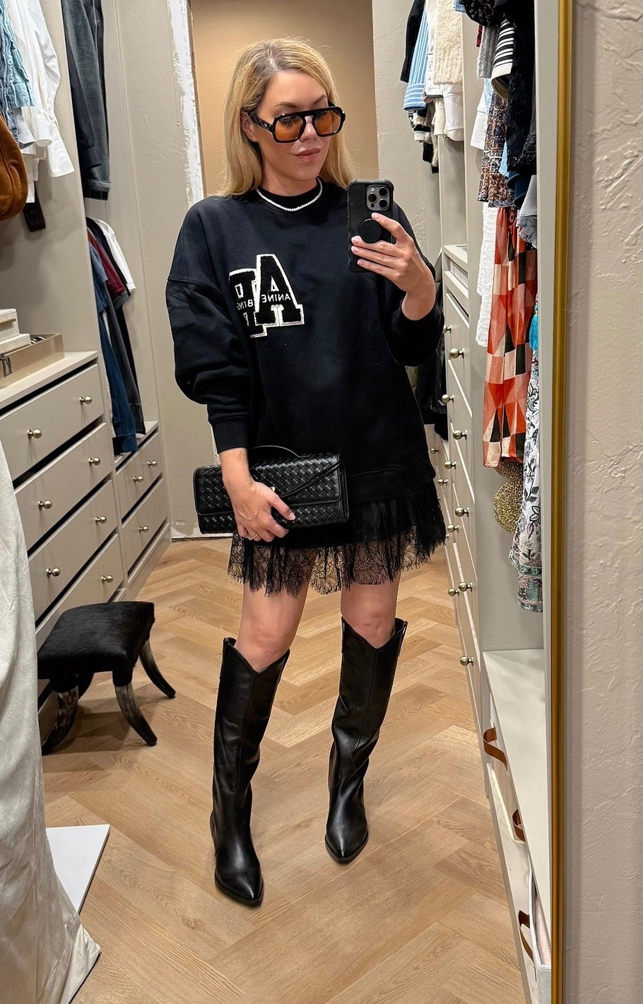 Anine Bing sweatshirt 
Lace skirt
Western boots 

#LTKSeasonal #LTKFindsUnder50