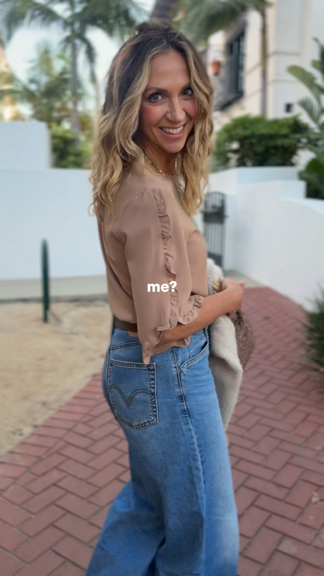 DATE NIGHT LOOK 🤍✨ Affordable + flattering pieces I’ll be mixing and matching all summer long.

This ruffle sleeve top is SUCH a good find for anyone who wants a lightweight summer top with a little extra arm coverage without feeling hot. The sleeves are so pretty and flattering, it comes in tons of colors and patterns, and some colors are marked down to only $15 right now 🙌 Perfect for business casual work outfits, date night outfits, vacation outfits, or just elevating your everyday summer outfits.

Paired it with my favorite @levi  wide leg jeans — so comfortable, flattering, and the perfect mid rise fit. Added my @Target  belt, chunky gold earrings, and this woven brown bag with the cutest gold zipper detail that honestly goes with everything. Finished the look with these super soft comfy kitten heel booties from Amazon and my cozy chic gold button cardigan.

Love that every piece in this outfit can be styled so many different ways 🤍 wearing a small in the blouse. I’m 5’7” sz SM on top and MED sz 6. 
Jeans run tts 
If in between on the boots size up!