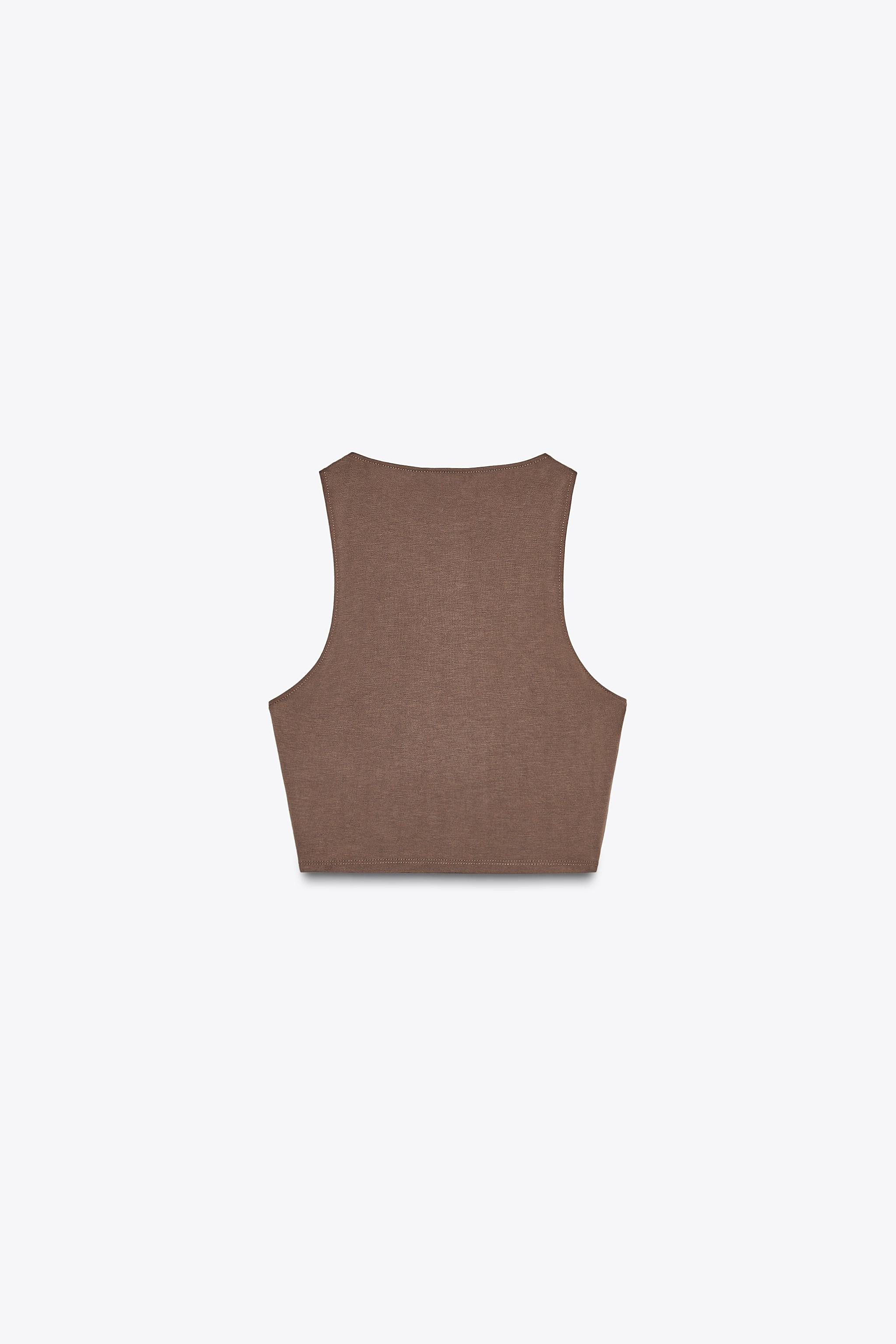 Flowing crop top. Round neck and sleeveless. | Zara UK