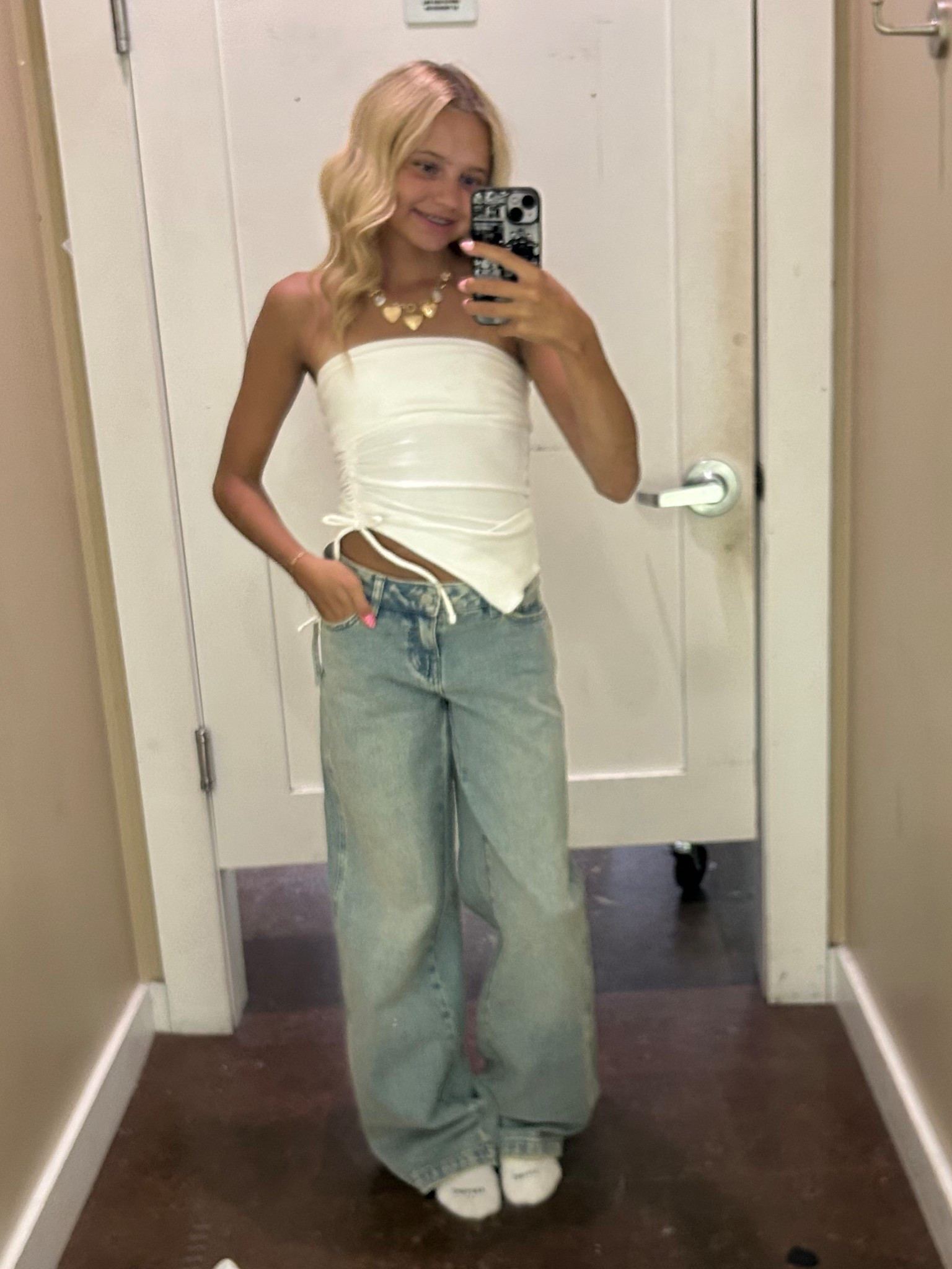 Strapless tube top
Slim fit
Features front cutout
Cotton-recycled polyester fabric with spandex
Asymmetrical design

Low Rise Baggy Jeans Medium Indigo Wash. These iconic jeans sit low on the waist for a trendy update and feature wide-leg openings that offer a comfortable baggy fit. They have a light blue and green tint to them that adds an extra layer of flair to your ensemble.