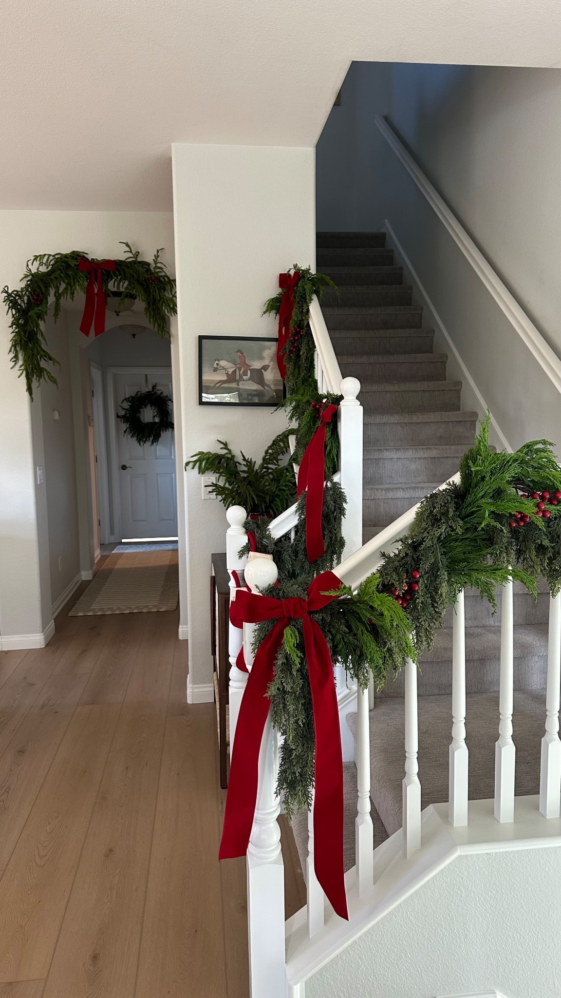 I mixed two different cedar garlands! One was pricier at $50/each and one was TikTok Shop Joyful Greenery that was 2 for $41! Garland staircase, garland Christmas, classic Christmas 

#LTKHome #LTKHoliday