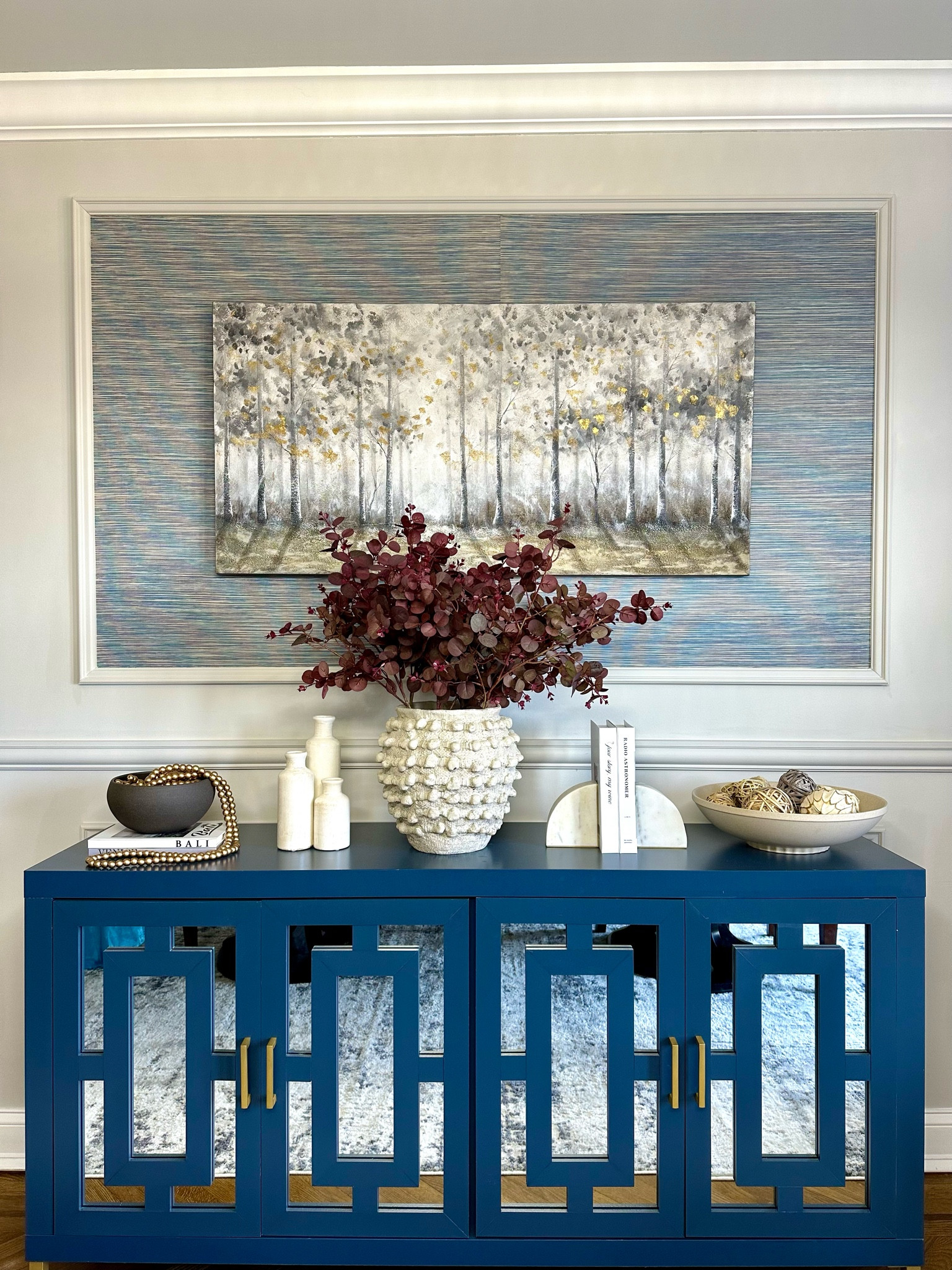 Console table styling. Sideboard styling. Console table decor. Home decor. Dining room decor. Anthropologie vase. Book ends. Small vases. 

#LTKSeasonal #LTKhome #LTKstyletip