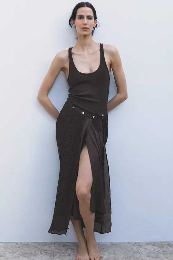 Midi dress with round neckline and sleeveless. Pleated overlay fabric with button and tie embelli... | Zara US