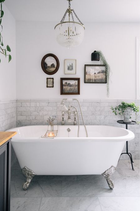 Our primary bathroom is so lovely especially with the mix metals. I love the polished nickel hardware and the claw foot tub we have in here. And can we just have a moment for that chandelier? So good  

#LTKhome