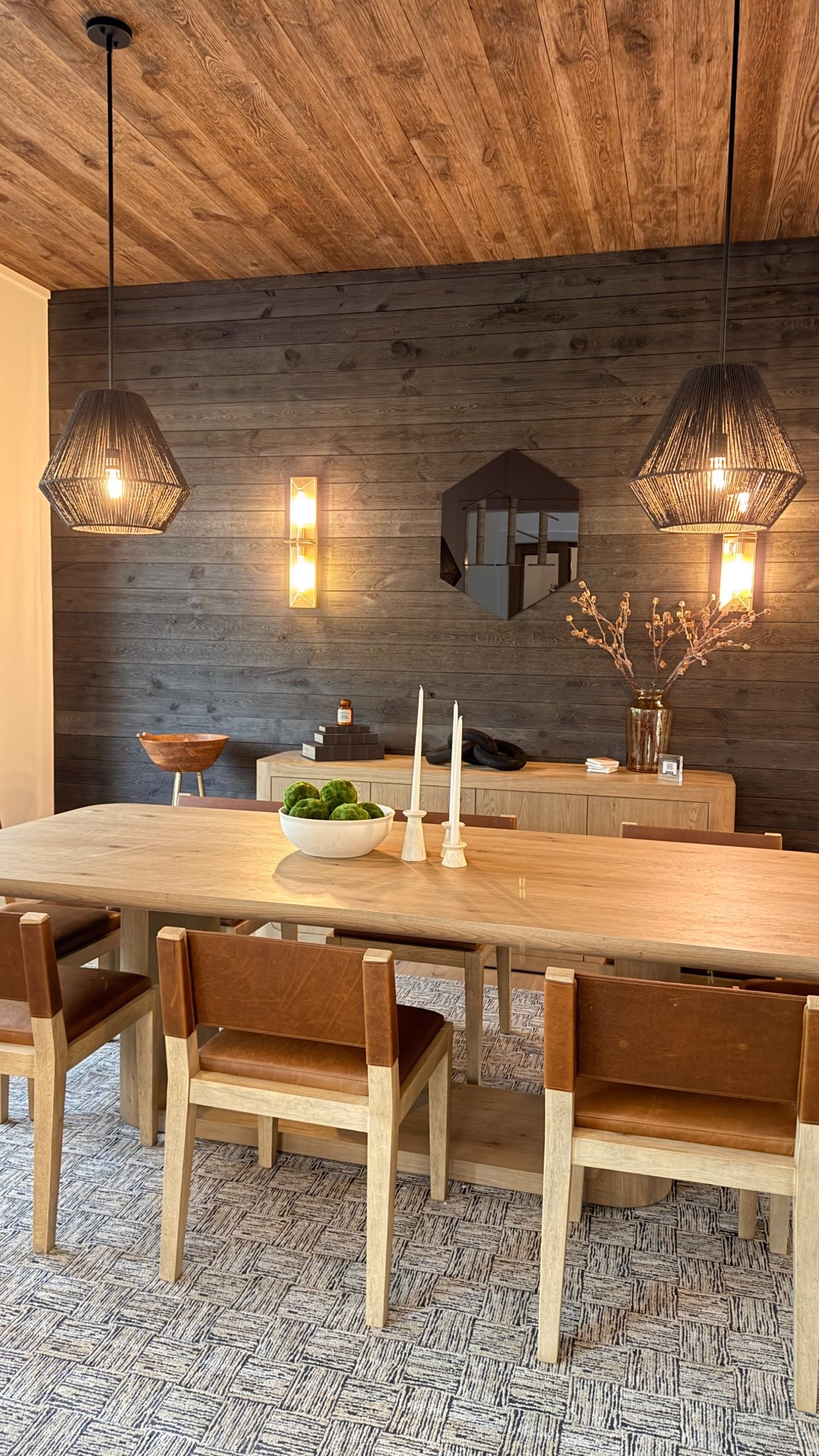 A space designed to feel warm, grounded, and quietly elevated.

Natural wood tones, layered textures, and soft lighting create a dining room that’s both inviting and refined. The contrast of the darker wall adds depth, while the mix of materials keeps it from feeling too heavy. Every piece was chosen to balance function and beauty so it feels just as good for everyday dinners as it does for hosting.

This model opens soon and I can’t wait to see it come to life.

#LTKHome