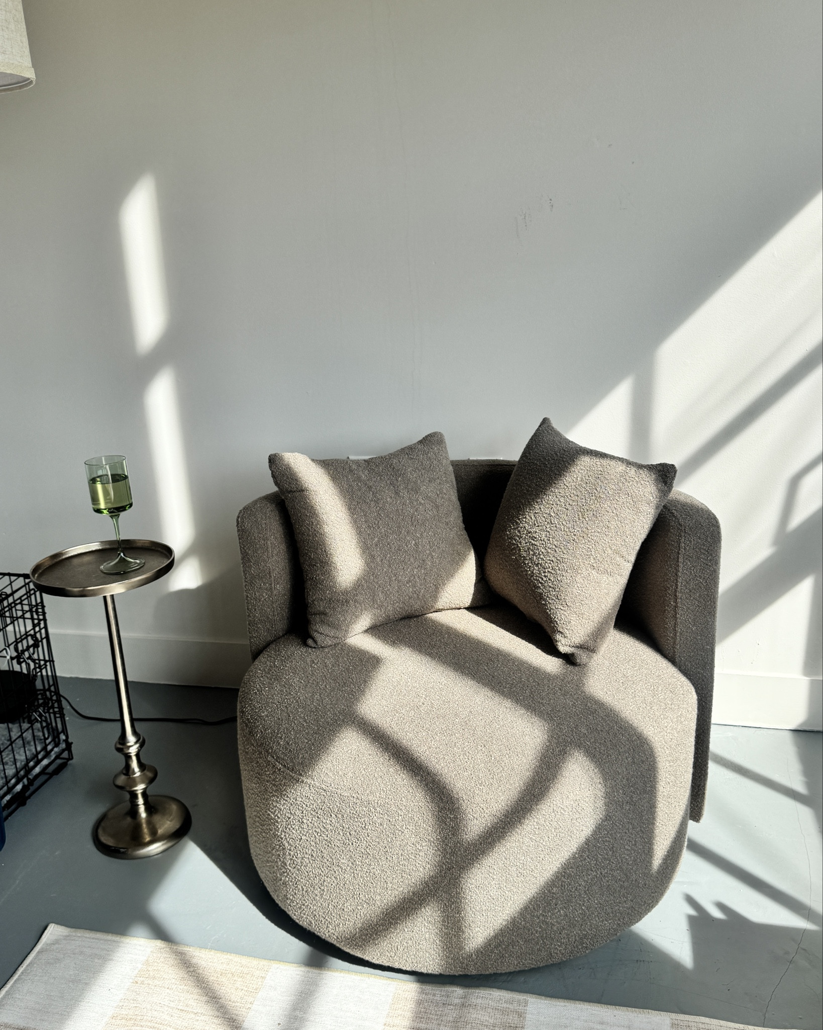 Trendy circle brown chair, checkered rug, Anthropologie glasswaree