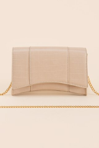 Fallon Embossed Arch Clutch | Francesca's