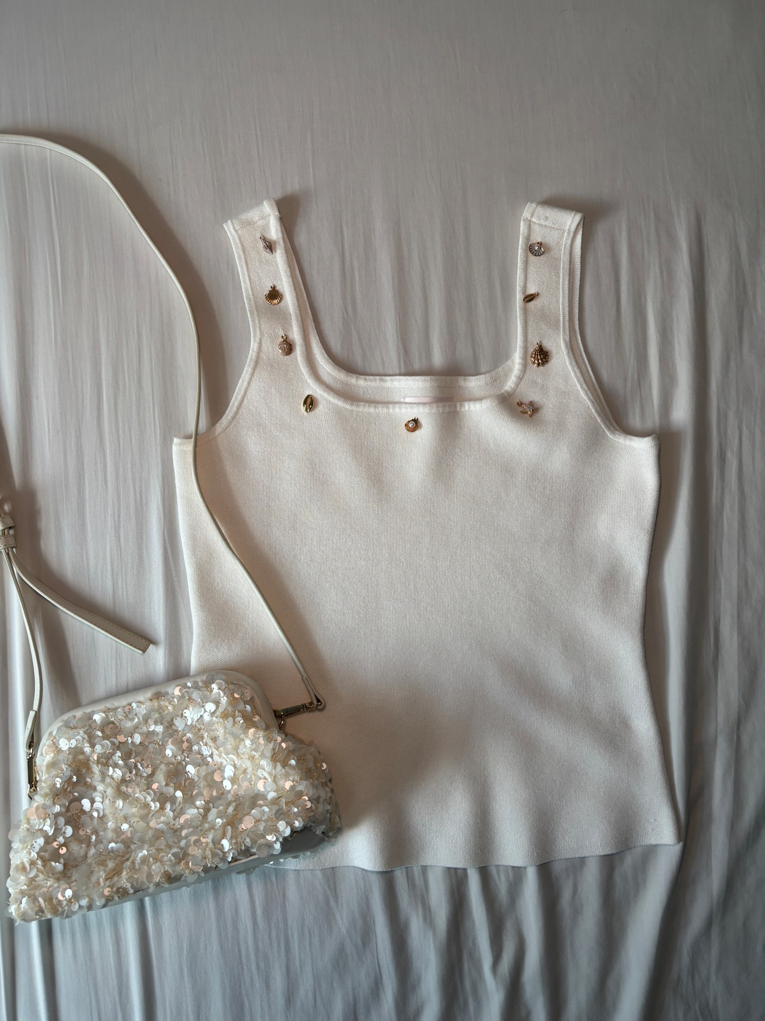 My fav find of the summer so far! Sequin purse and charm tank top. 🤩✨🤍💫🐚

#LTKFindsUnder50 #LTKStyleTip #LTKSeasonal